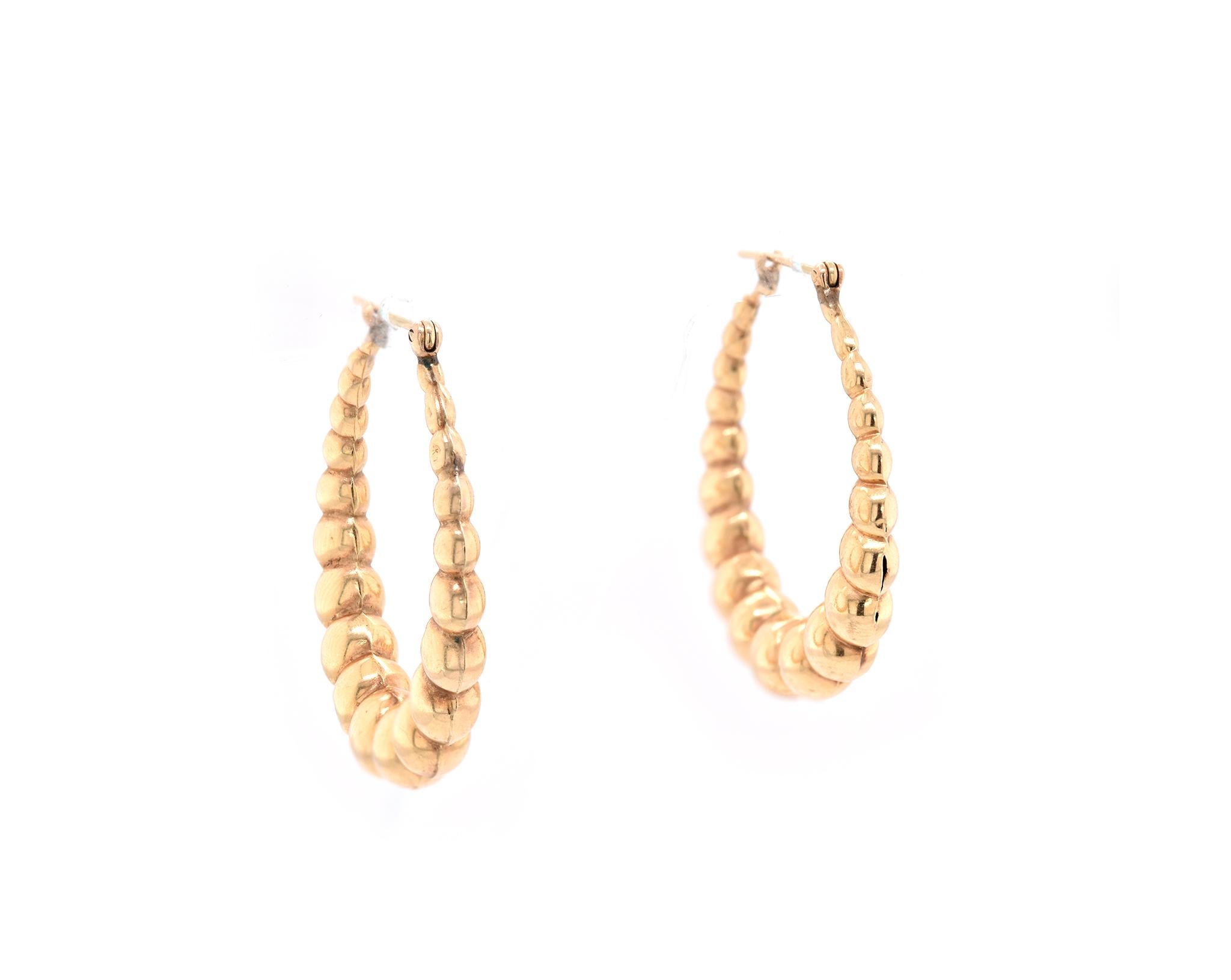 Material: 14k yellow gold
Dimensions: earrings measure 37.46mm wide
Fastenings: snap closure
Weight: 6.40 grams
