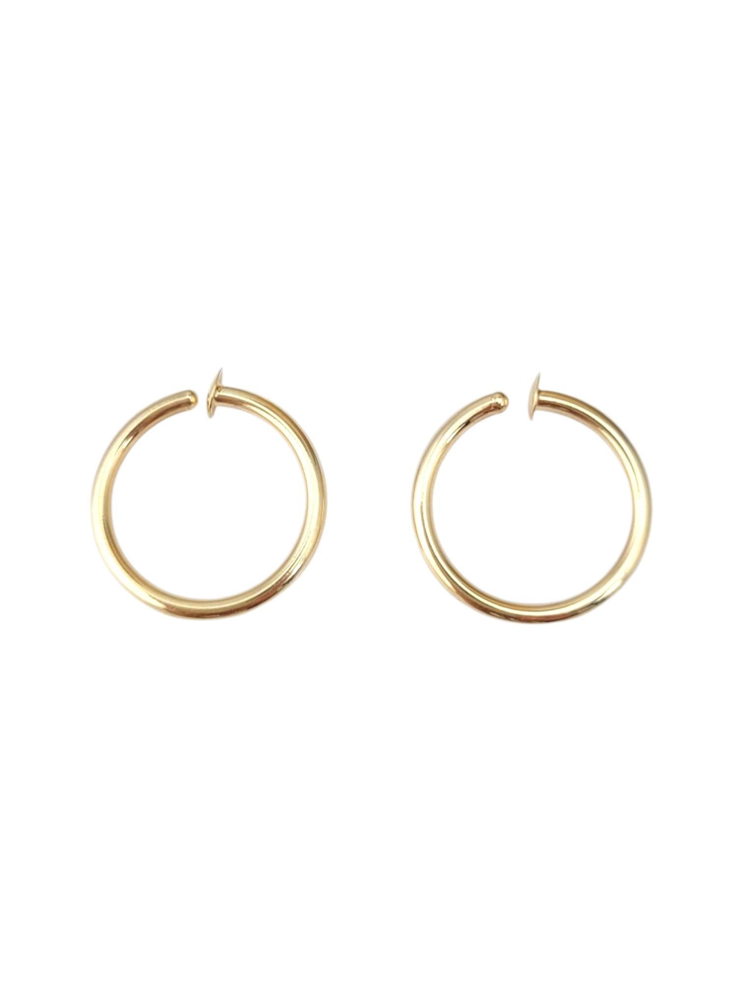 14K Yellow Gold Hoop Twist On Earrings -

These hoop earrings feature a timeless, versatile design that suits any style. With their smooth, polished finish and classic silhouette, they’re perfect for everyday wear or adding a subtle touch of