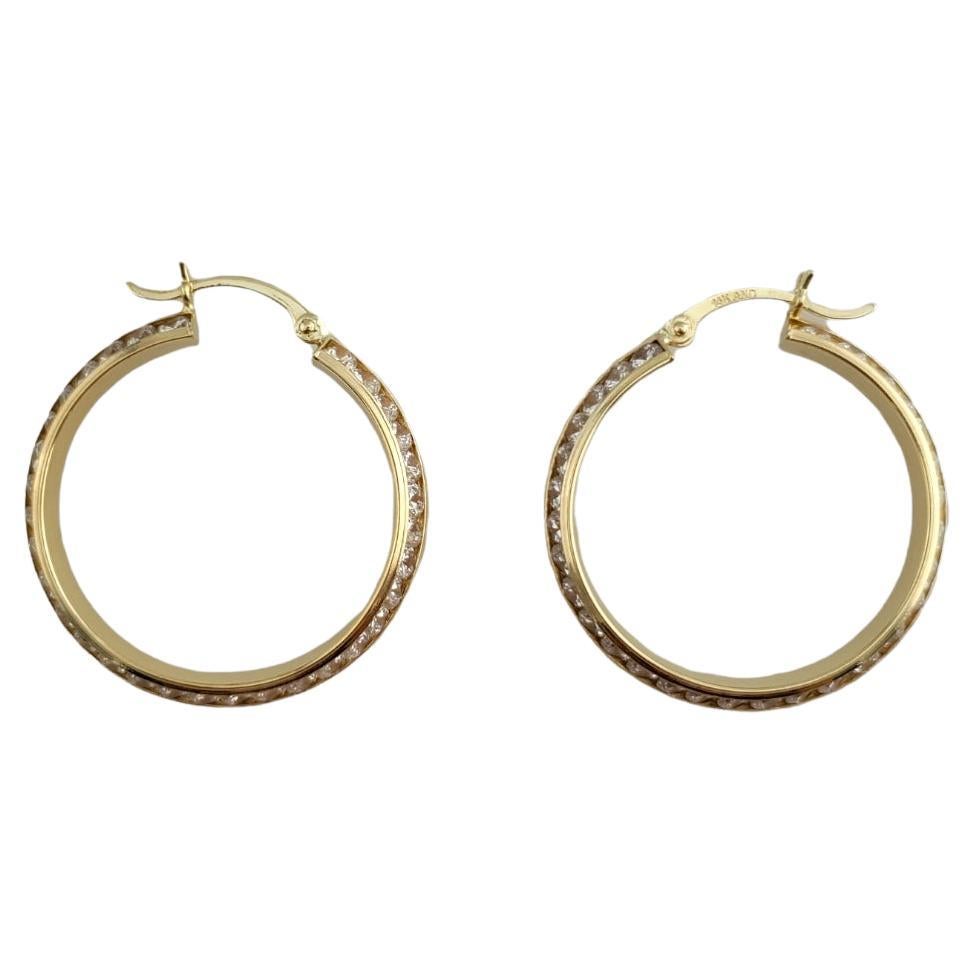 14K Yellow Gold Hoops with Clear Stone For Sale