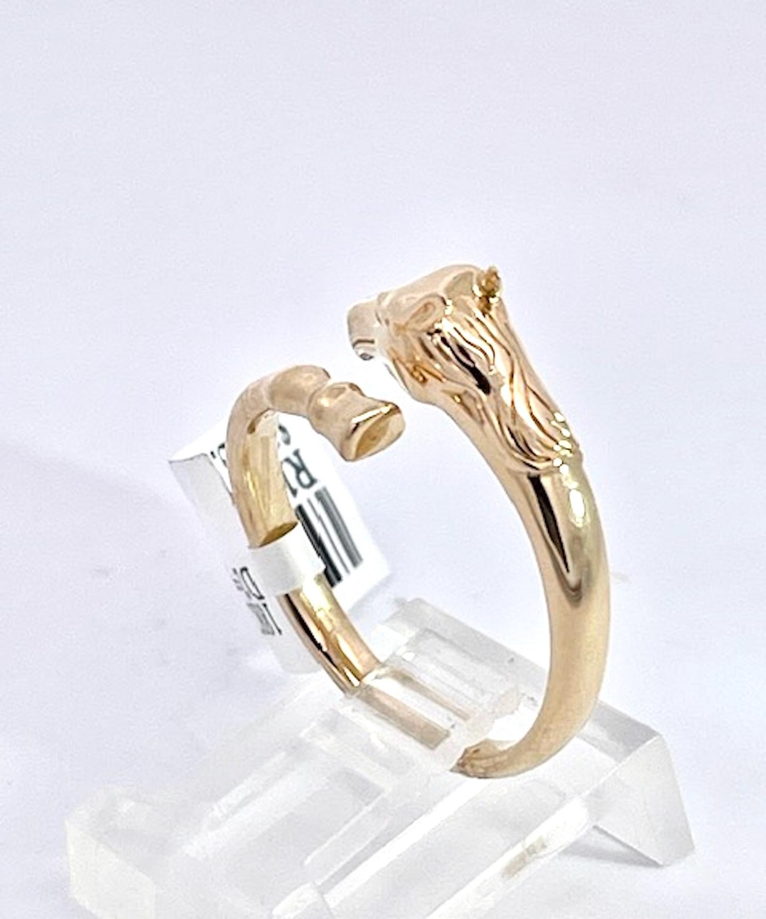 This 14K Yellow Gold ring is Doves by Doran Paloma and it is cute and special.  It depicts a horse head and horse hoof is gold with tiny Diamond eyes.  All horse lovers rejoice, here is your special ring.  This ring is small in stature and thin it