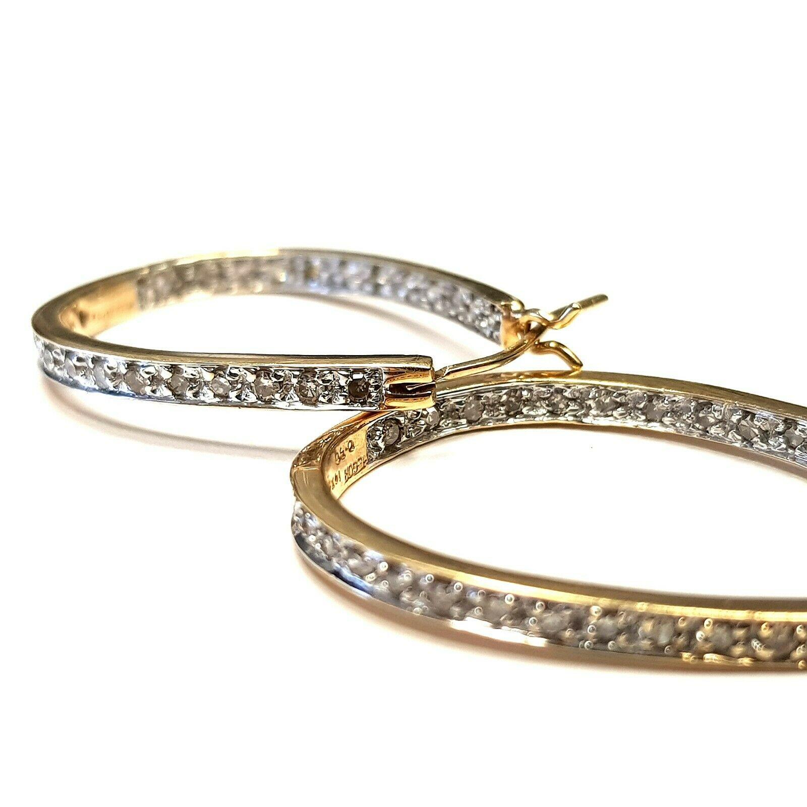  14k Yellow Gold Horseshoe Hoop Earrings With Natural Diamonds  
Pre-Owned
Main Stone:   diamonds
Appr. 52 stones 1.00Cttw 
Shape:  Round 
Total Carat Weight:   1.00Cttw
Color:    H
Clarity:    SI2 
Jewelry Specifications
Metal: 14k Yellow Gold Gold