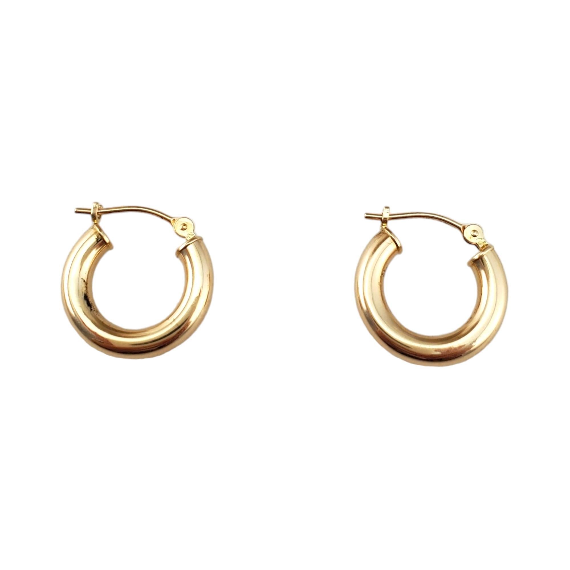 14K Yellow Gold Huggie Hoops 

Crafted from genuine 14K yellow gold, these hoops feature a sleek and minimalist design that hugs the earlobe snugly for a comfortable fit.

Hallmark: 14k EG

Weight: 0.8 g/ 0.5 dwt.

Thickness: 3 mm

Diameter: 15.2