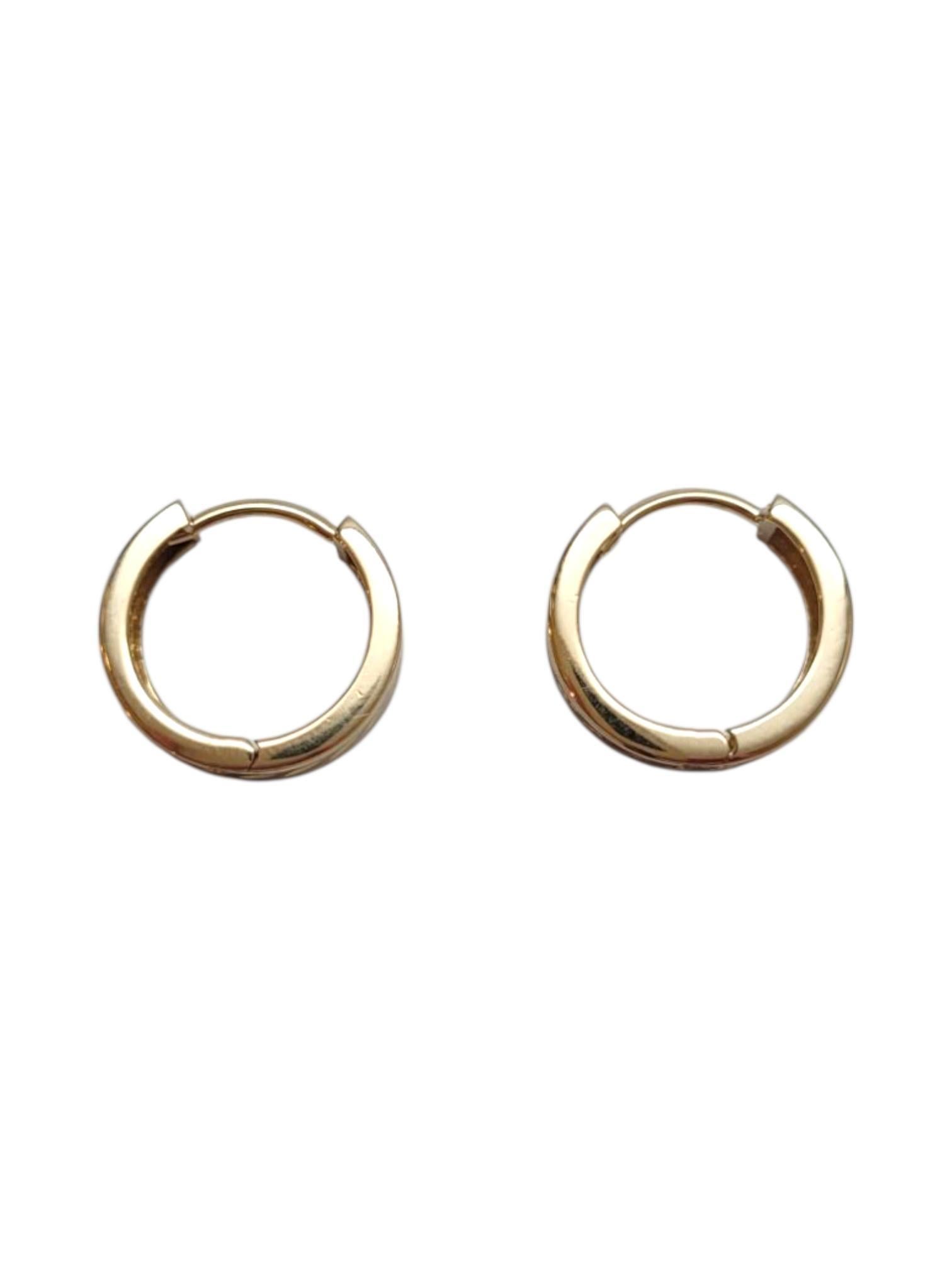 14K Yellow Gold Hoop Earrings

These hoops are a golden opportunity for a flawless look! Meticulously detailed in 14K yellow gold, these hoops are crafted with excellence.

Size: 13.4 mm X 14.1 mm X 4.5 mm

Thickness: 1.7 mm

Weight: 2.8 g / 1.8