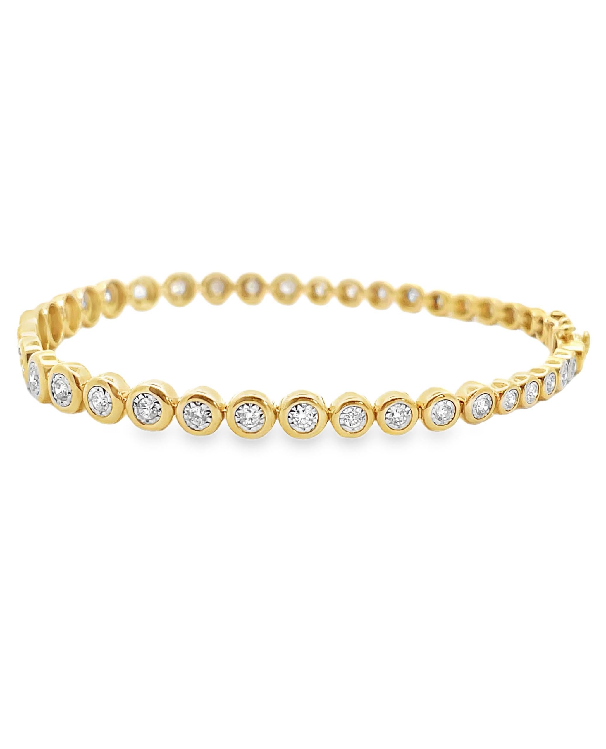 Pulsera graduada de oro amarillo de 14 quilates con diamantes redondos talla brillante engastados en ilusión que pesan 1,18 quilates en total.  

- La pulsera mide 7,5 pulgadas de largo.
- Los diamantes son de color G/H y claridad SI.
- Figura 8