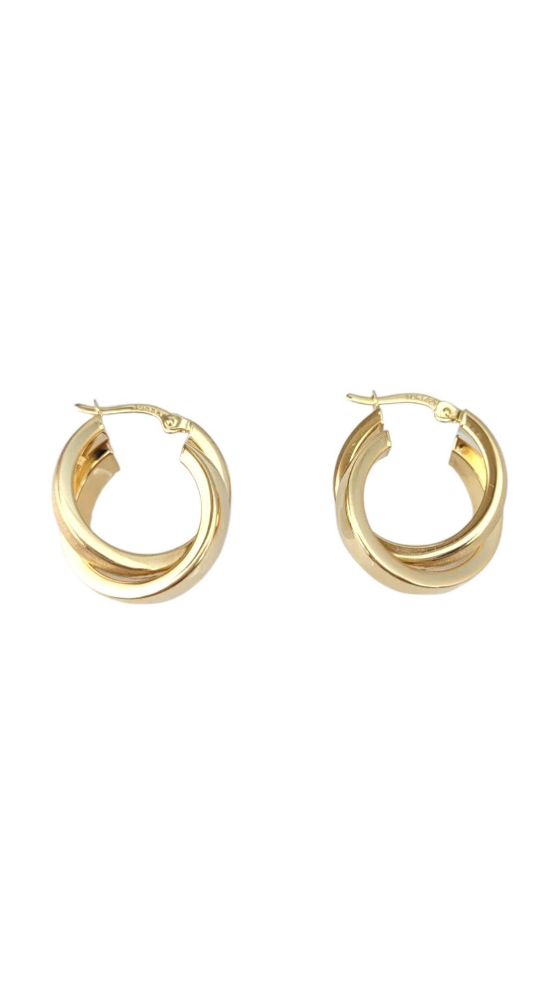 14K Yellow Gold Interlocked Hoop Earrings-

These interlocked hoop earrings feature a unique, intertwined design that symbolizes connection and unity. With their elegant curves and polished and sandblasted finish, they offer a modern twist on the