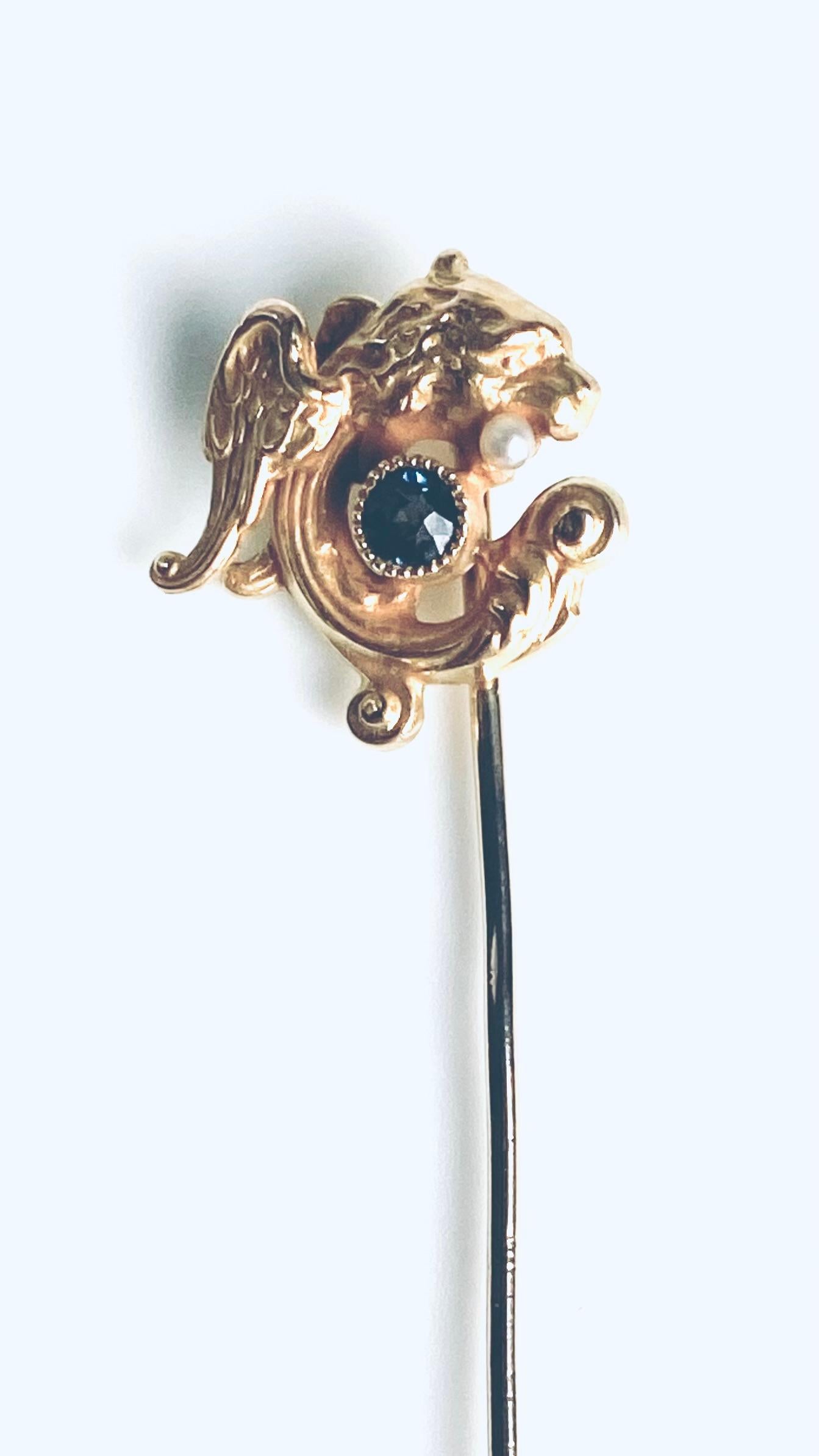 14K Yellow Gold Intricately Coiled Fish Brooch with Sapphire in his Mouth In Good Condition For Sale In New York, NY
