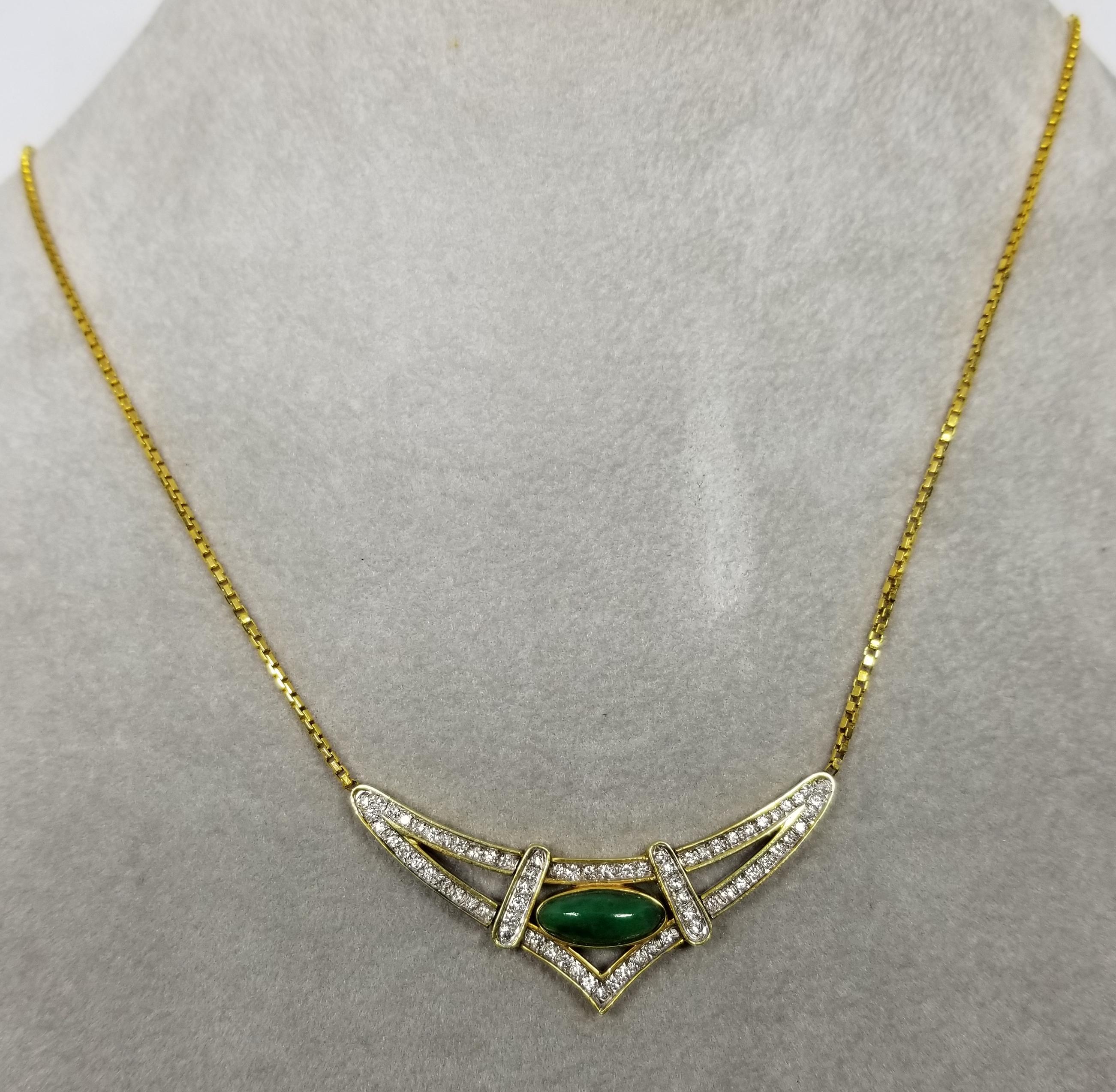This piece of fine jewelry was designed and hand crafted by “Moshi” of New York, it was found in a vault from an estate sale and was never used.  14k yellow gold jade and diamond pendant, containing 1 oval cabochon jade13 x 5.5mm and 78 round full