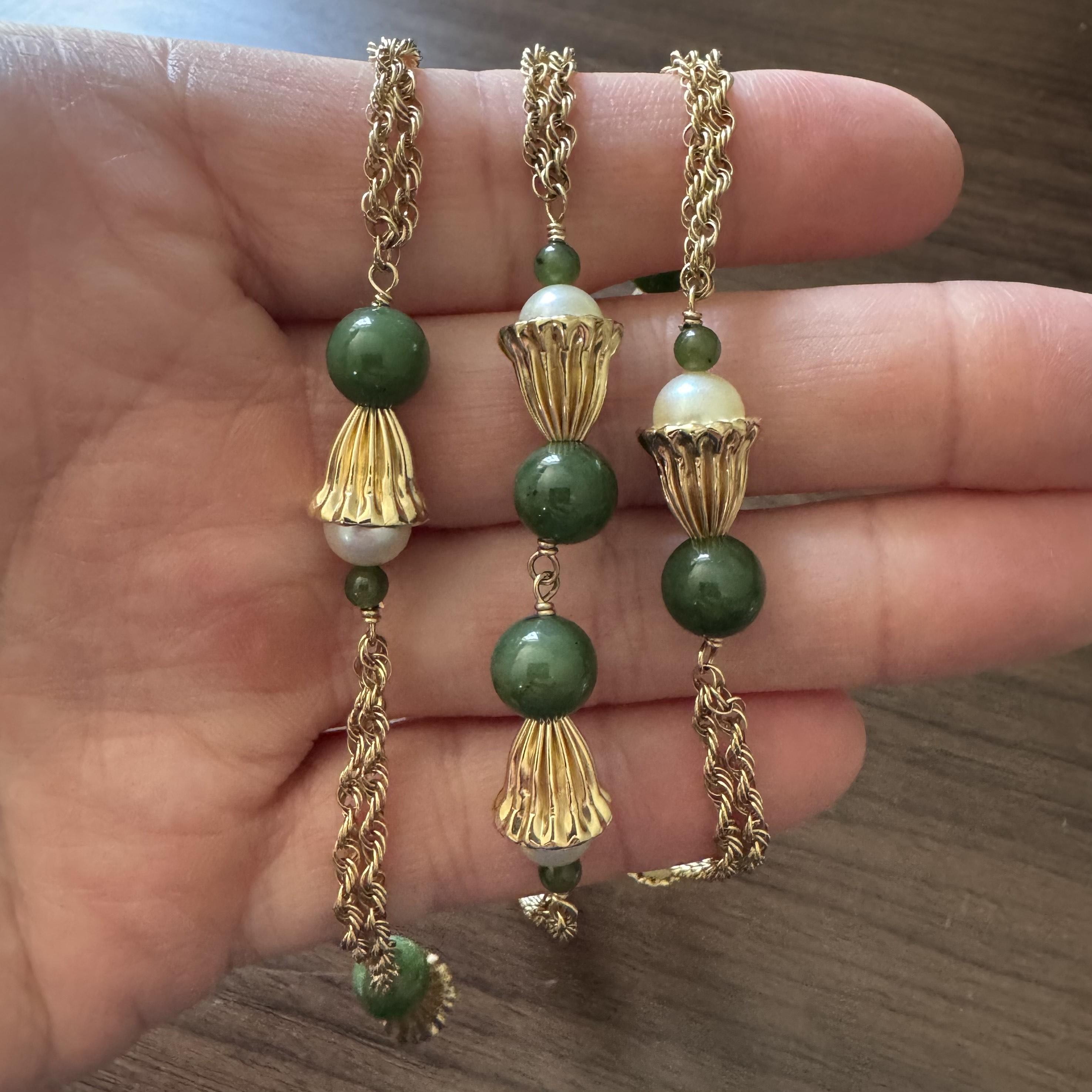 Condition:  Excellent Condition, Professionally Cleaned and Polished
Metal:  14k Gold (Marked, and Professionally Tested)
Weight:  36.9g
Length:  30 Inches
Width:  11mm at widest
Gemstone: Round Green Jade
Gemstone:  Round White