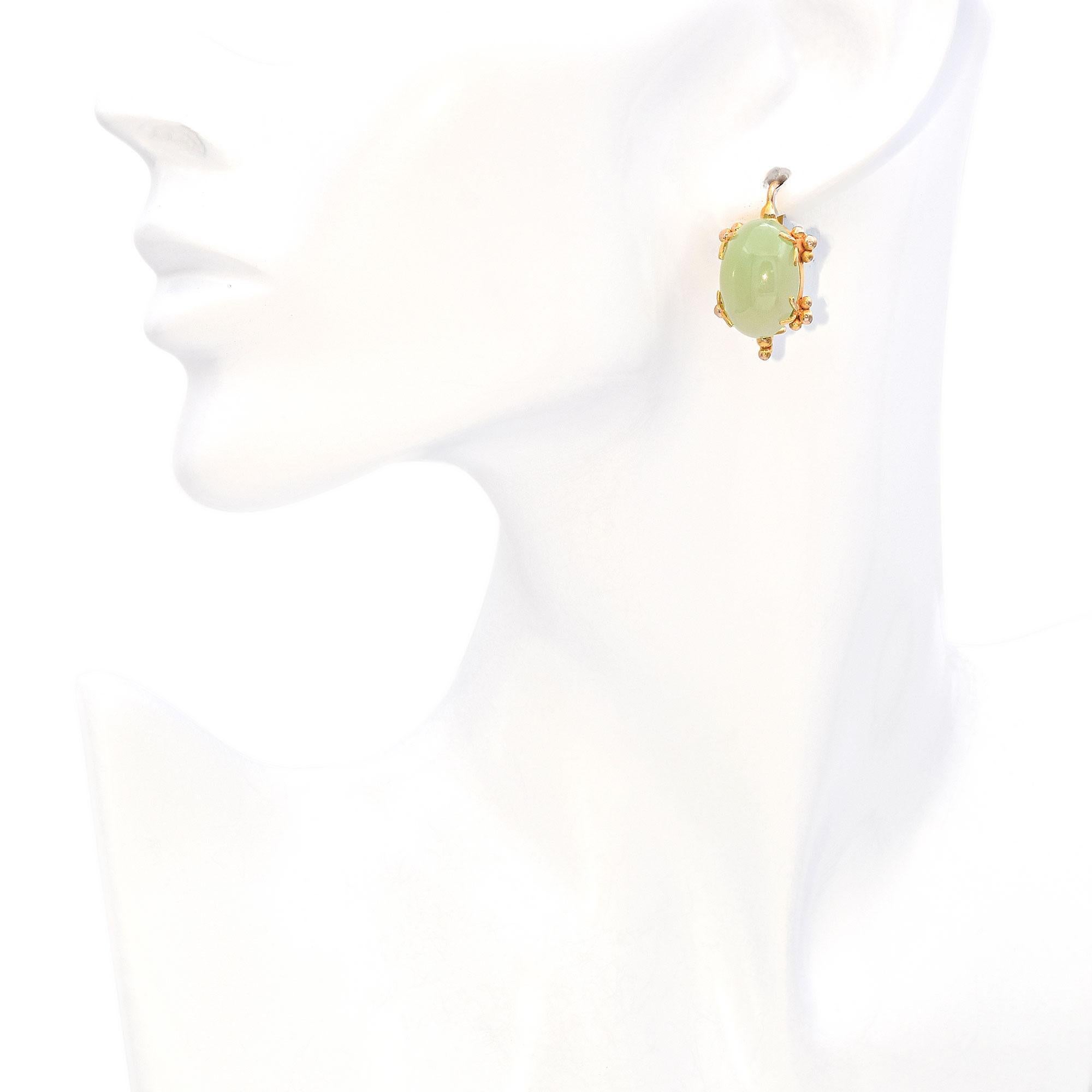 Elegant drop earrings crafted in 14k yellow gold, featuring smooth cabochon-cut jade stones. The soft green hue of the jade offers a serene and sophisticated look, ideal for both casual and formal settings. Refined and timeless.

Weight: 8.9