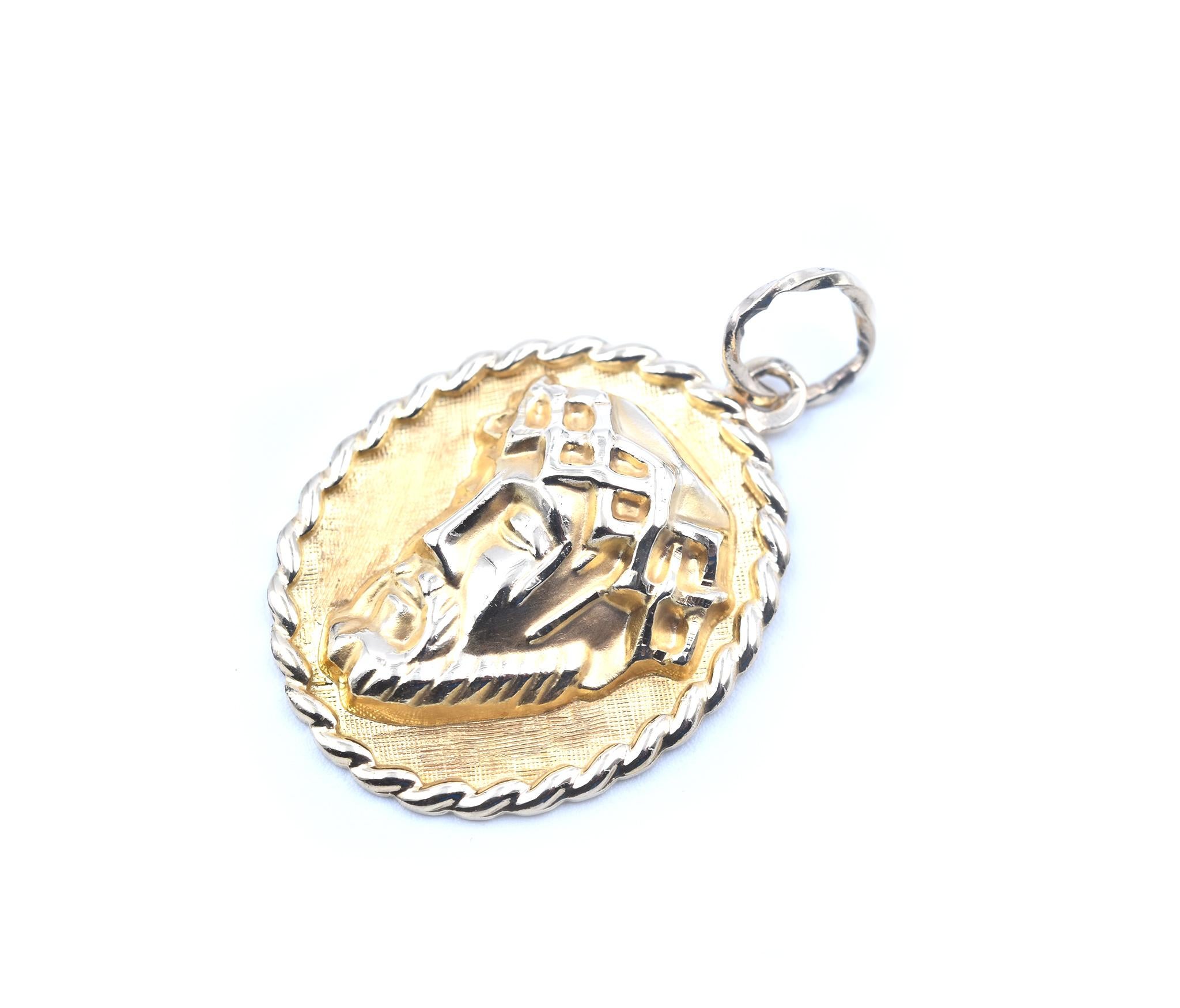 Designer: custom design
Material: 14k yellow gold
Dimensions: pendant measures 23.20mm x 28mm without the bail
Weight: 4.31 grams

