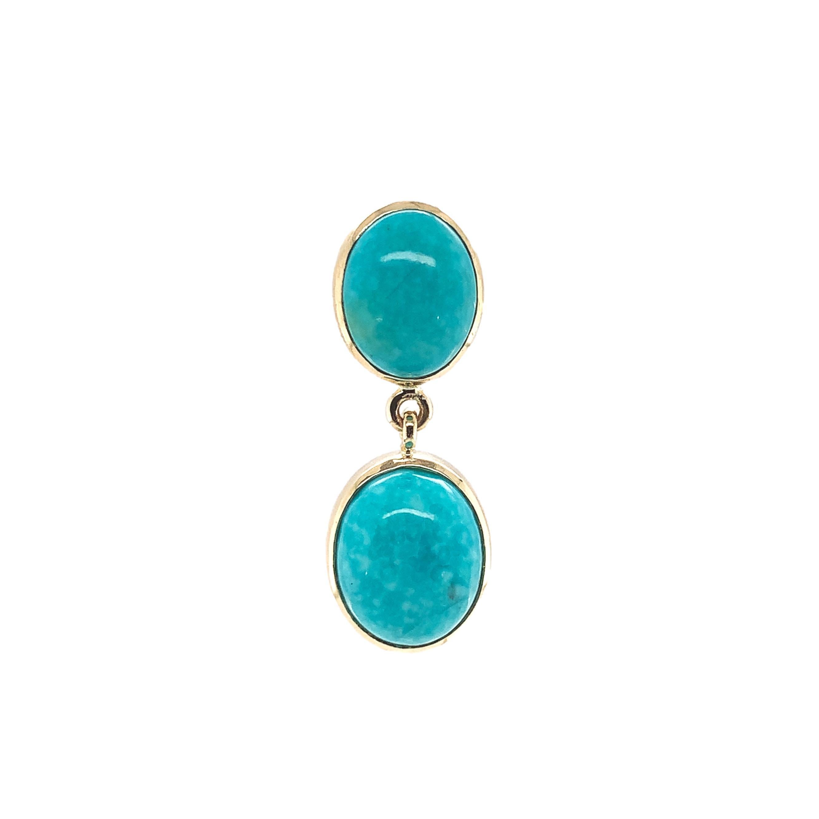 14K yellow gold pair of turquoise stud earrings with dangle drops. This is Kingman turquoise from Arizona, which is the last full-time production mine in the US. The turquoise measures about 9mm x 7mm on the top and 10mm x 8mm for the drops and
