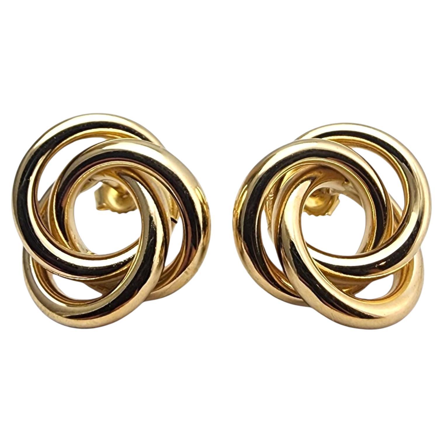 Pendientes de oro amarillo de 14 quilates con nudo #22847