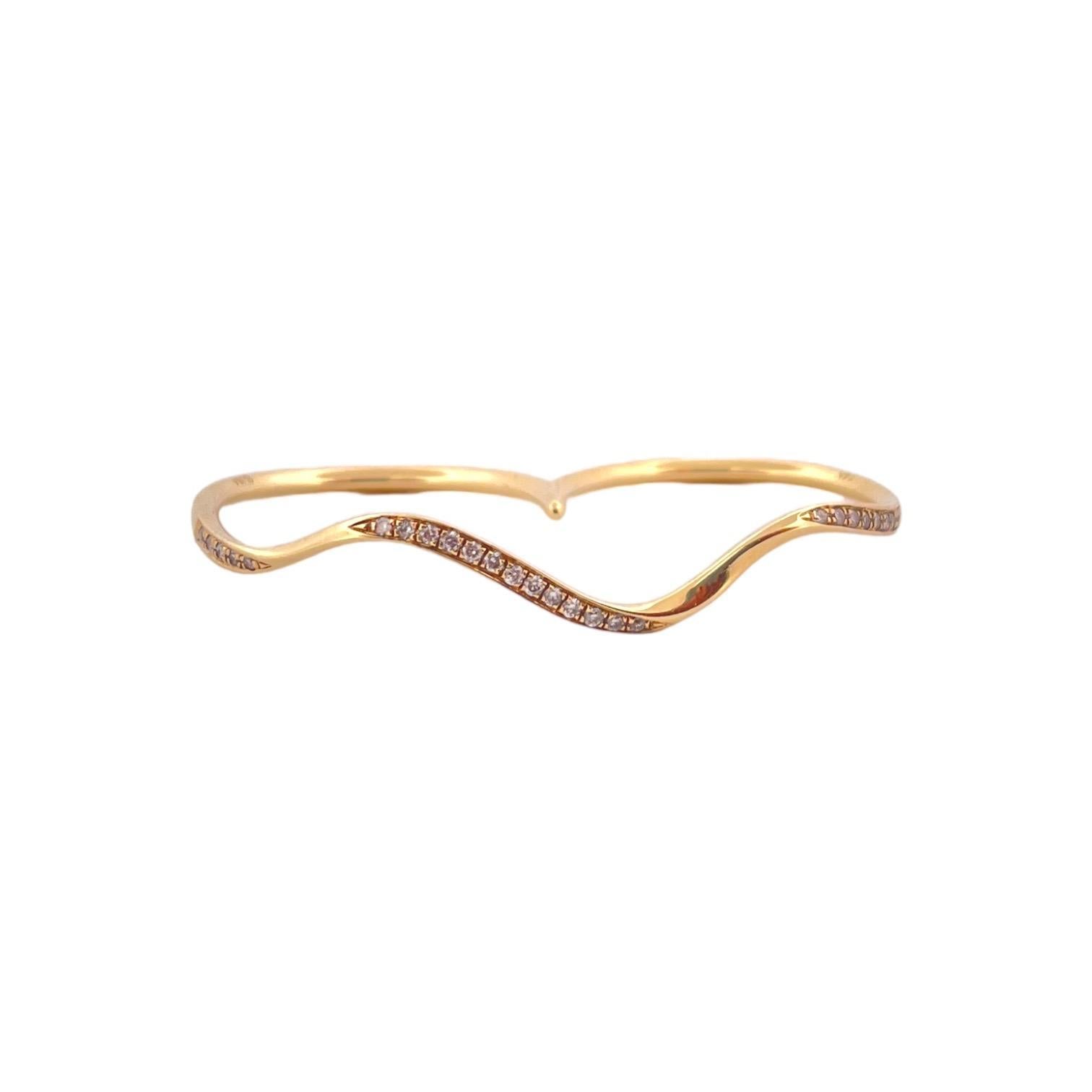 Elevate your style with our 14K Yellow Gold Knuckle Wavy Diamond Ring, a distinctive piece that exudes sophistication and charm. Weighing 2.54 grams and featuring a total carat weight (TCW) of 0.11, this ring showcases a unique wavy design adorned