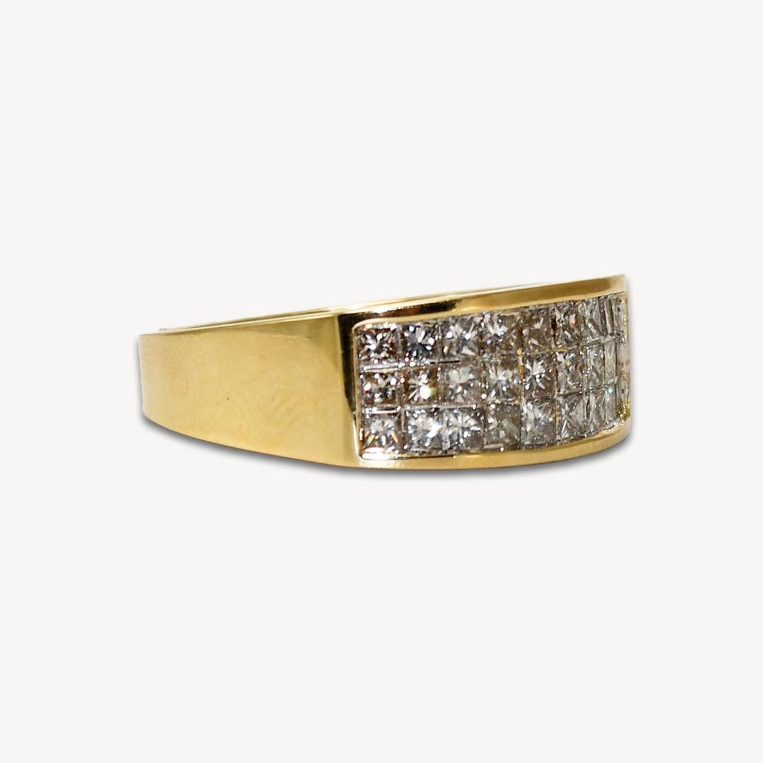Diamond band in 14k yellow gold.
Tests 14k and weighs 6.6 grams.
The diamonds are princess cuts, 1.00 total carats, I color, SI clarity.
The diamonds are invisible set in three rows.
The band measures 7.7mm wide at the top.
Ring size is 7 1/4 and