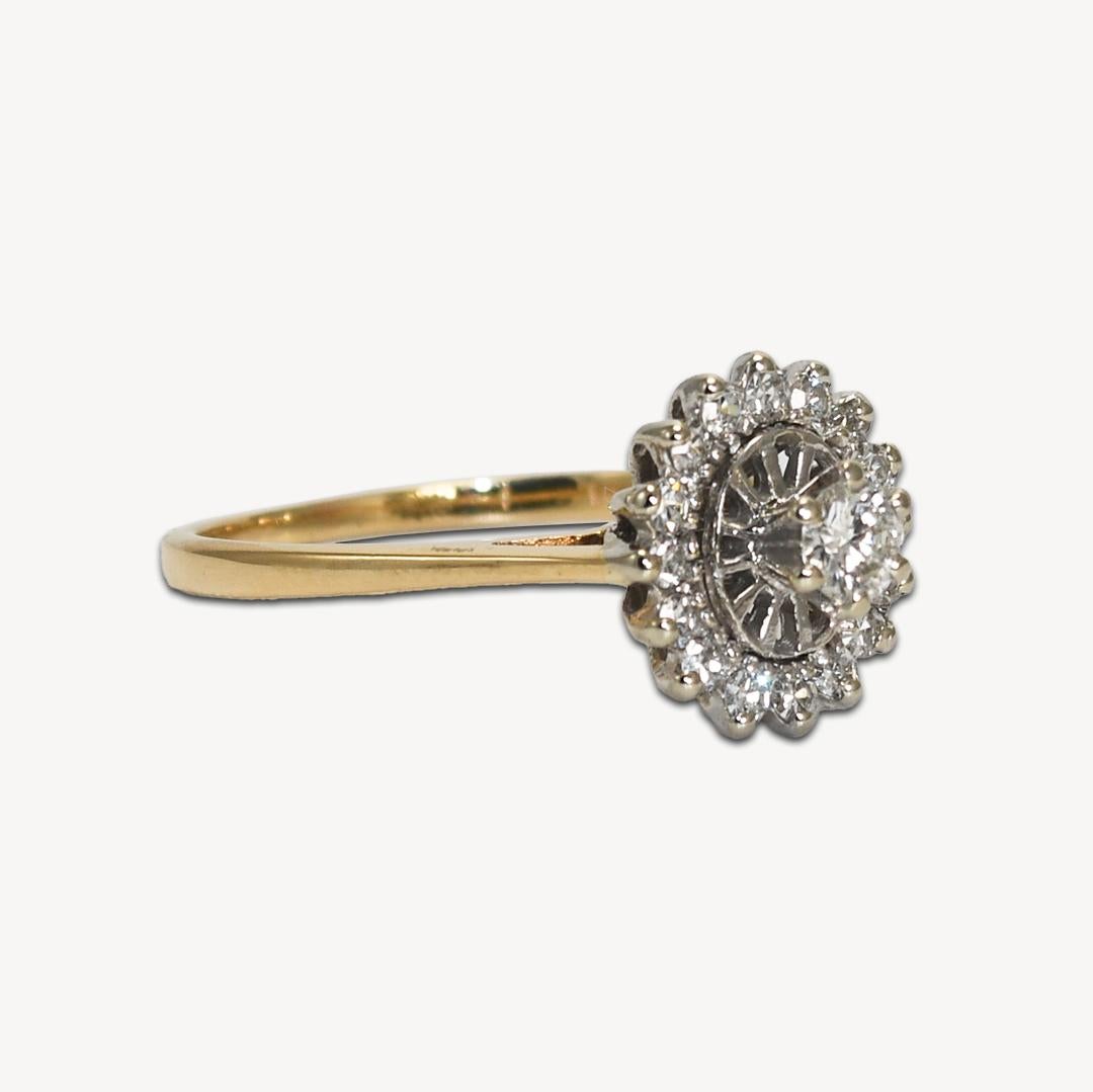 Ladies diamond ring in 14k yellow gold.
Marked 14k and weighs 2.8 grams.
The center diamond is a round brilliant cut, .18 carats, g to h color, vs clarity.
On the sides are round, single-cut diamonds, .20 total carats, g color, vs clarity.
The ring