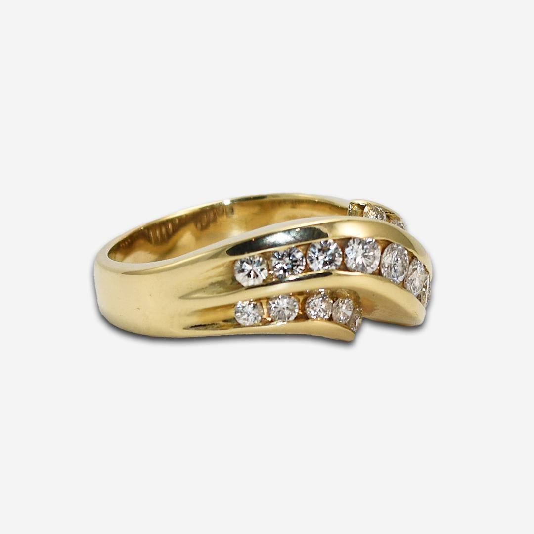 Ladies ribbon style diamond ring in 14k yellow gold. 
Tests 14k and weighs 6.7 grams. 
The diamonds are round brilliant cuts,1.00 total carats, H color, and Si clarity. 
The ring size is 7 1/2 and can be sized.
Like new condition.  