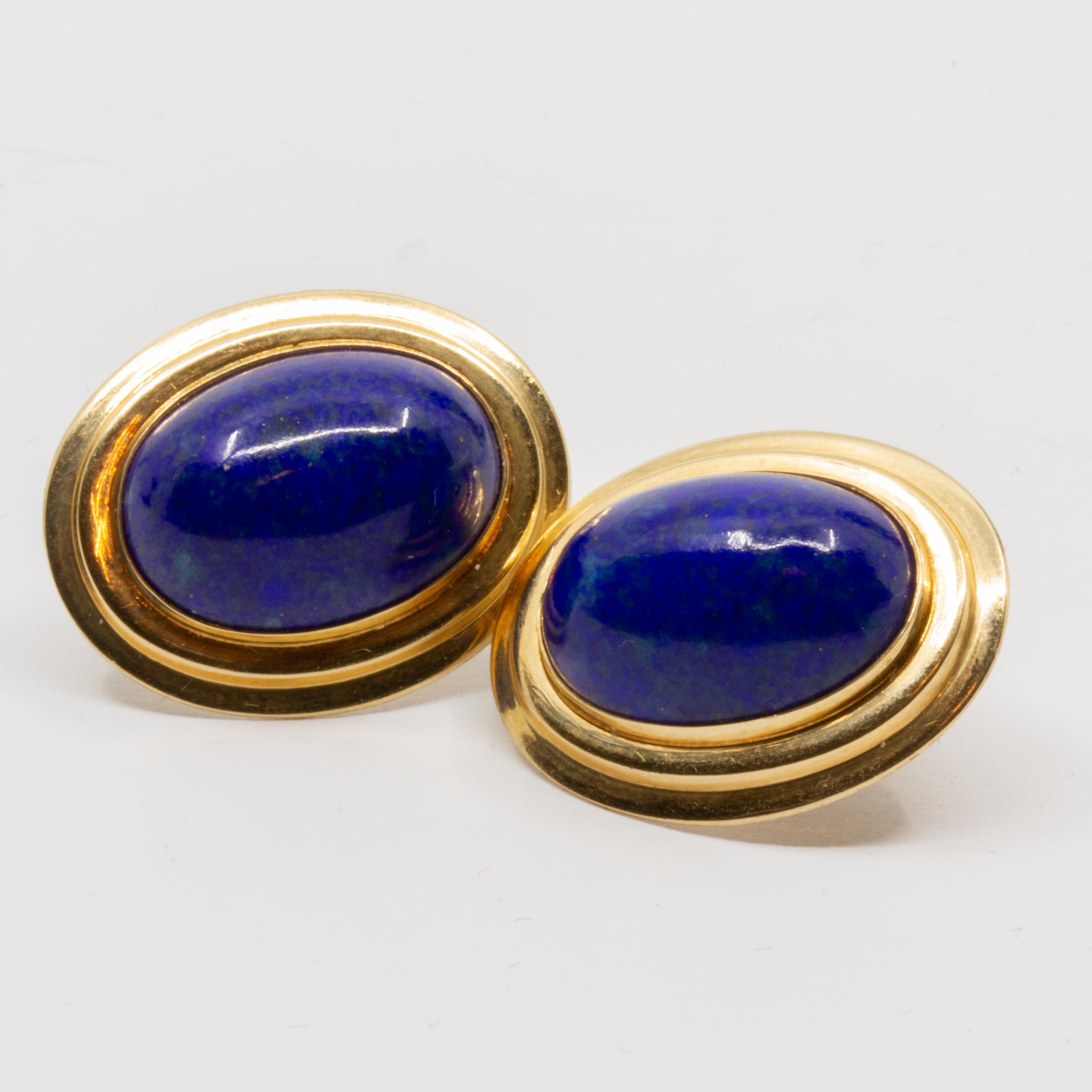 Offered is a pair of 14K yellow gold oval lapis and gold earrings 17.5 x 12.8mm Circa 1980
