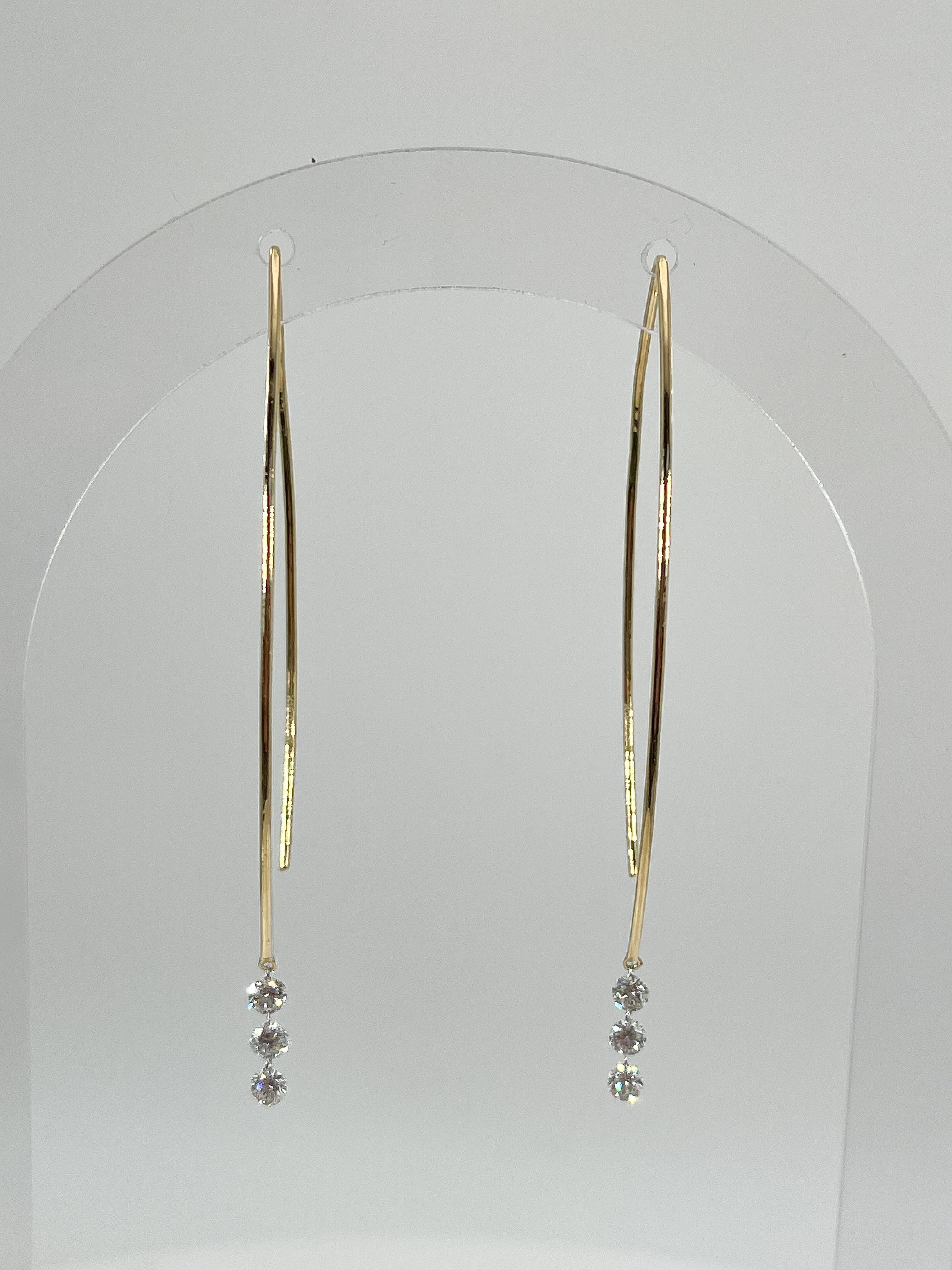 14k yellow gold large fancy hoop with .57 CTW diamonds. Each earring has 3 individually drilled diamonds for a seamless look. Hoop measures 17.5 x 49.8 mm and both earrings have a total weight of 3 grams.