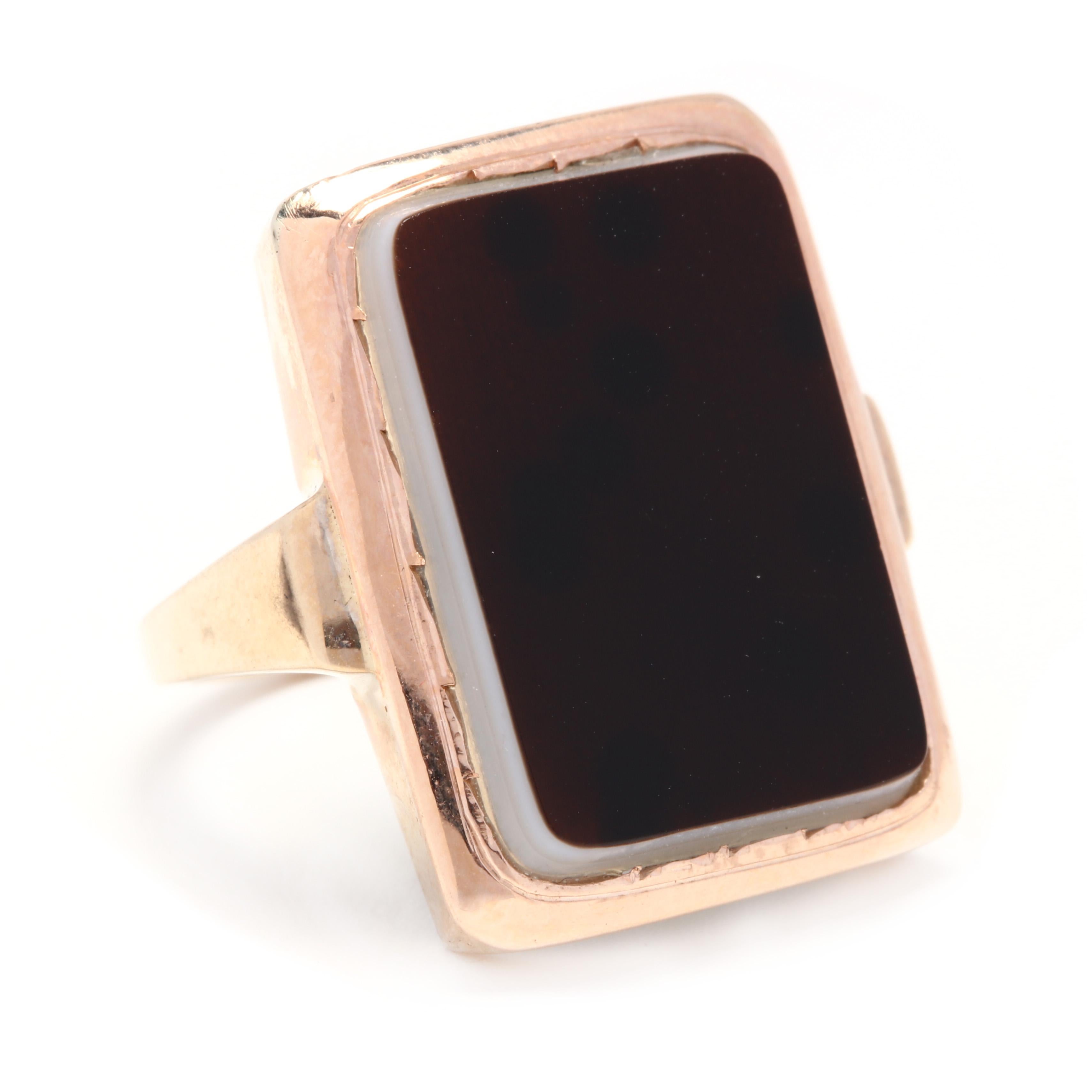 14k yellow gold large rectangular sardonyx ring. A vintage men's or women's ring with a rectangle-shaped sardonyx that measures 20.5x14.9mm. It is a great piece as is or could be engraved with an initial. 

Stones:
- sardonyx
- rectangular tablet, 1