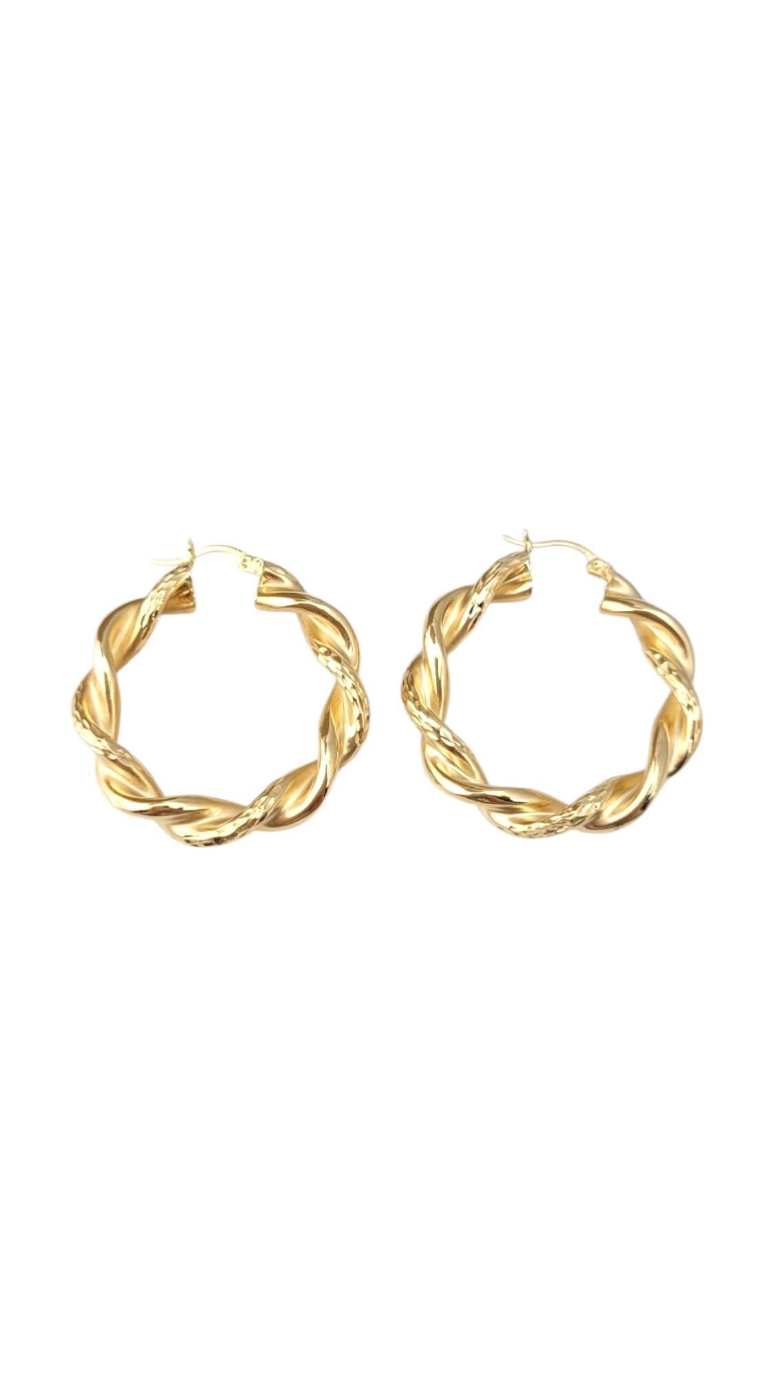 14K Yellow Gold Large Twisted Hoop Earrings-

These twisted hoop earrings feature a beautifully sculpted design that adds texture and visual interest to a classic silhouette. Elegant and versatile, they offer a modern edge while maintaining timeless