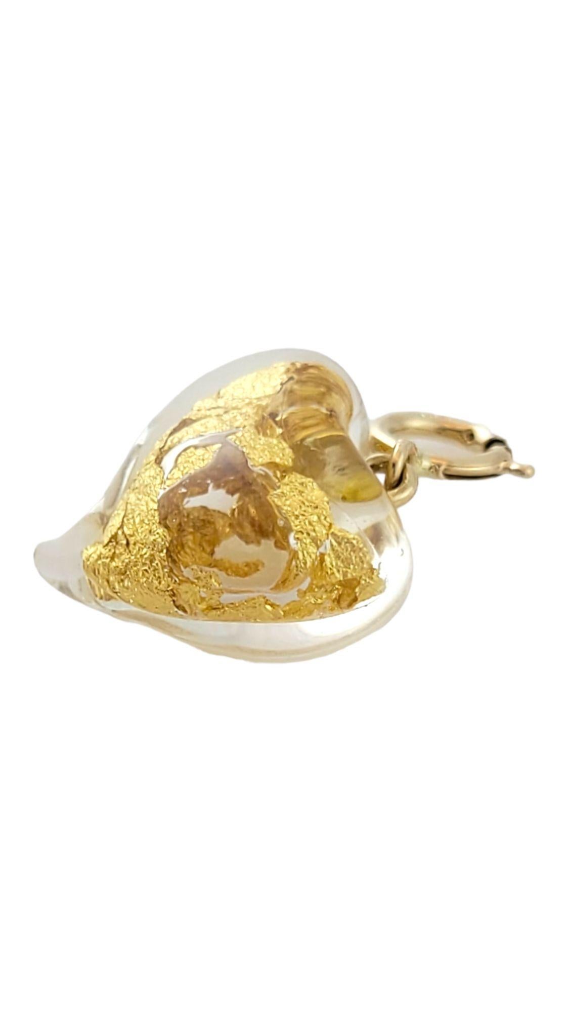 This gorgeous heart pendant is filled with beautiful 14K gold leaf specks!

Size: 15.3mm X 13.9mm X 8.4mm

Length w/ bail: 22mm

Weight: 1.5 g/ 0.9 dwt

Hallmark: 585

Very good condition, professionally polished.

Will come packaged in a gift box