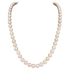 Collier de perles rose claire en or jaune 14 carats