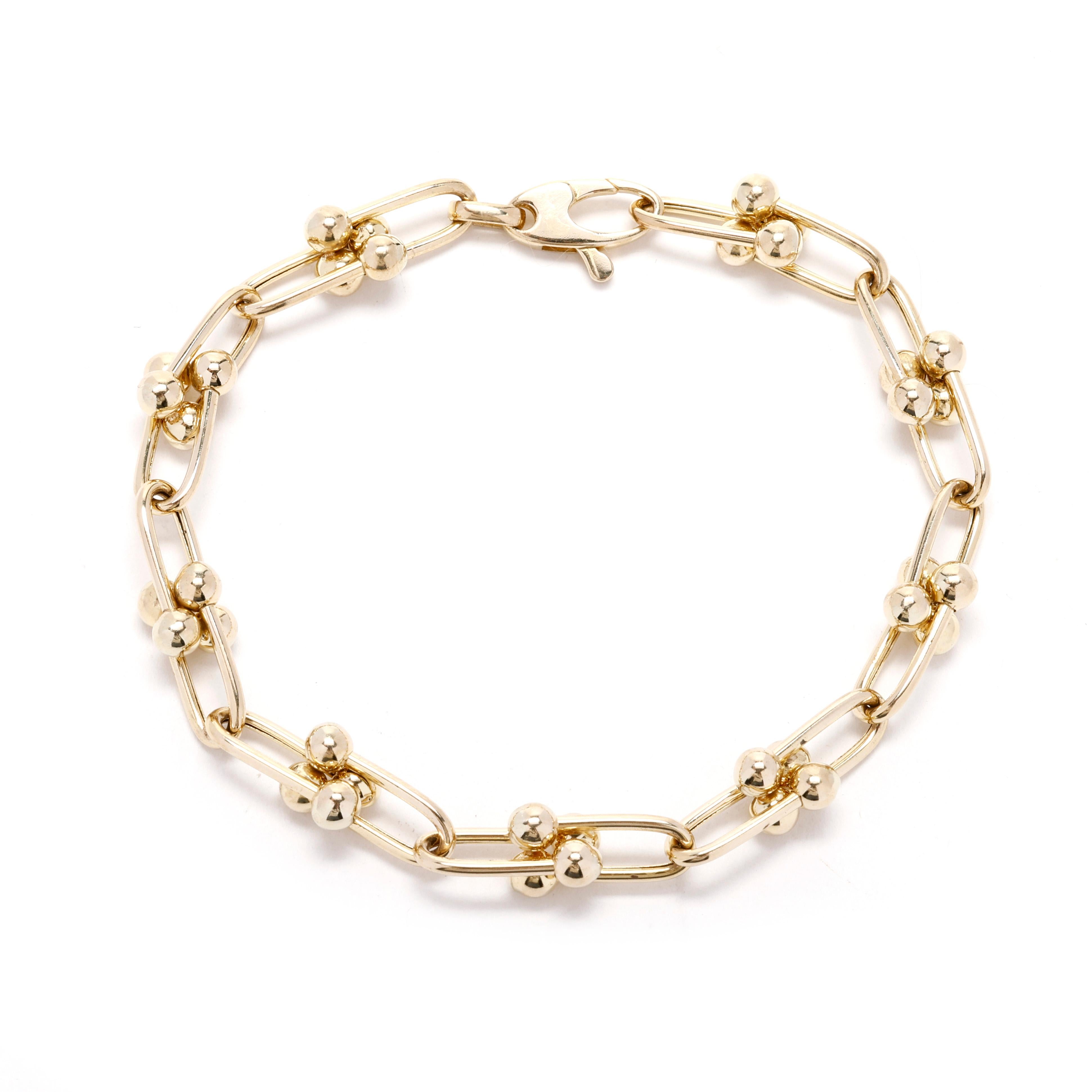 Elevate your everyday style with this elegant 14k Yellow Gold Link Bracelet. Crafted in luxurious 14k yellow gold, this classic link bracelet features a timeless design that is perfect for everyday wear, whether worn alone for a subtle touch of