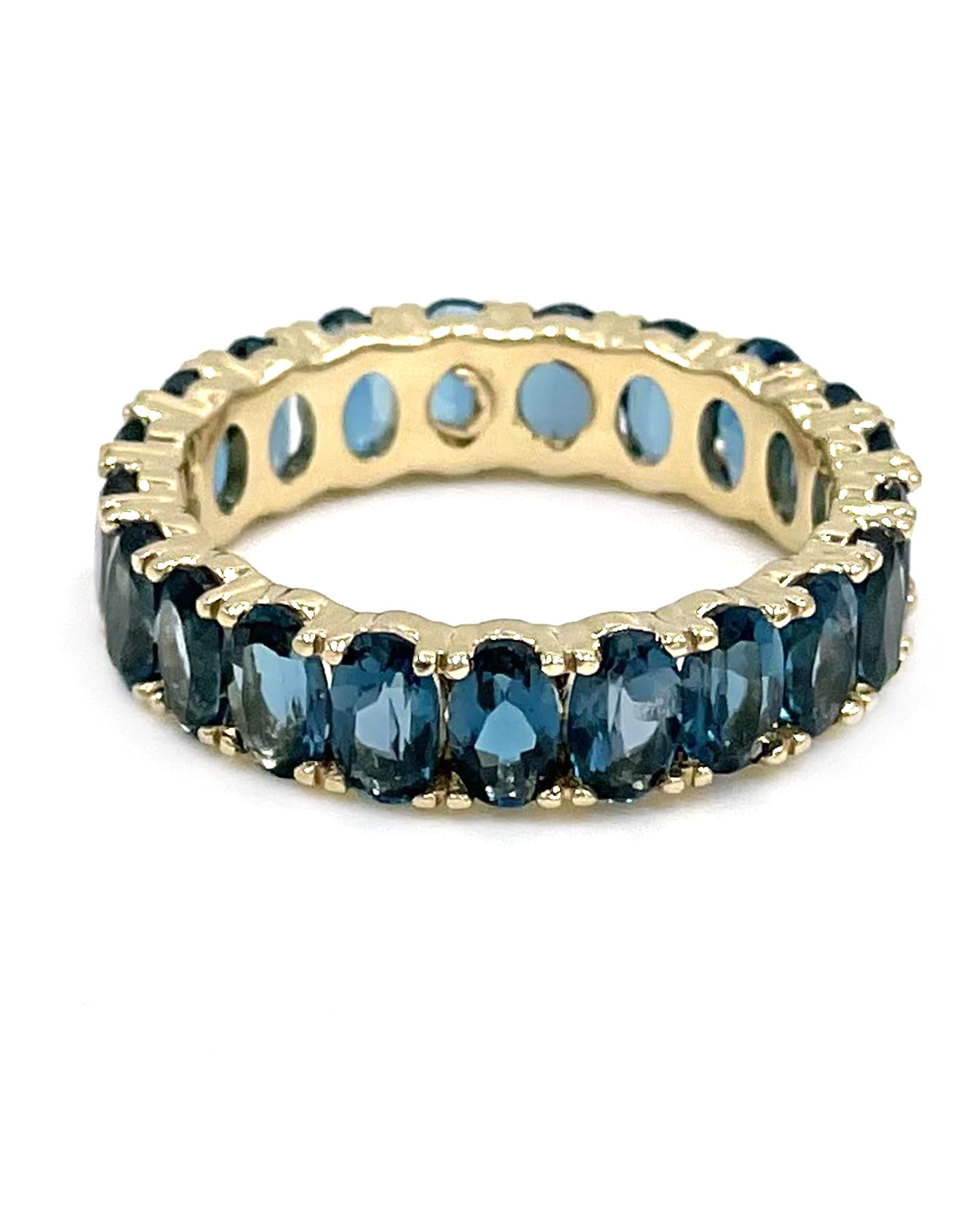 14K white gold eternity ring with 21 oval shaped London blue topaz 5.71 carats total weight.

* Finger size 8
* 5.10mm wide