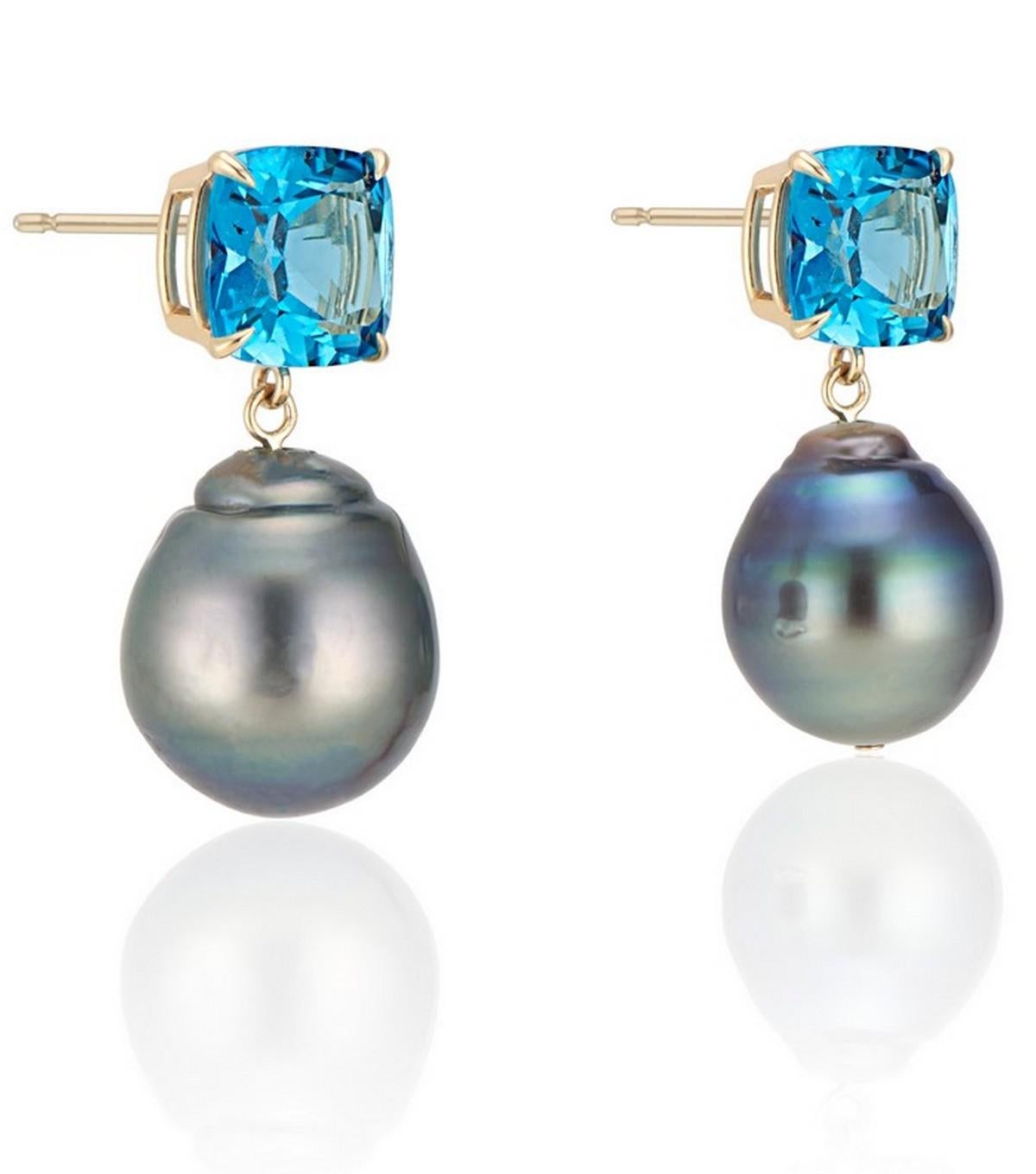 A Striking Cushion Cut London Blue Topaz with contrasts with the luminous natural peacock green freshwater baroque pearl drop create a a unique show stopping earring.

Set in a high polish 14k Yellow gold basket with claw setting.

The pearl is