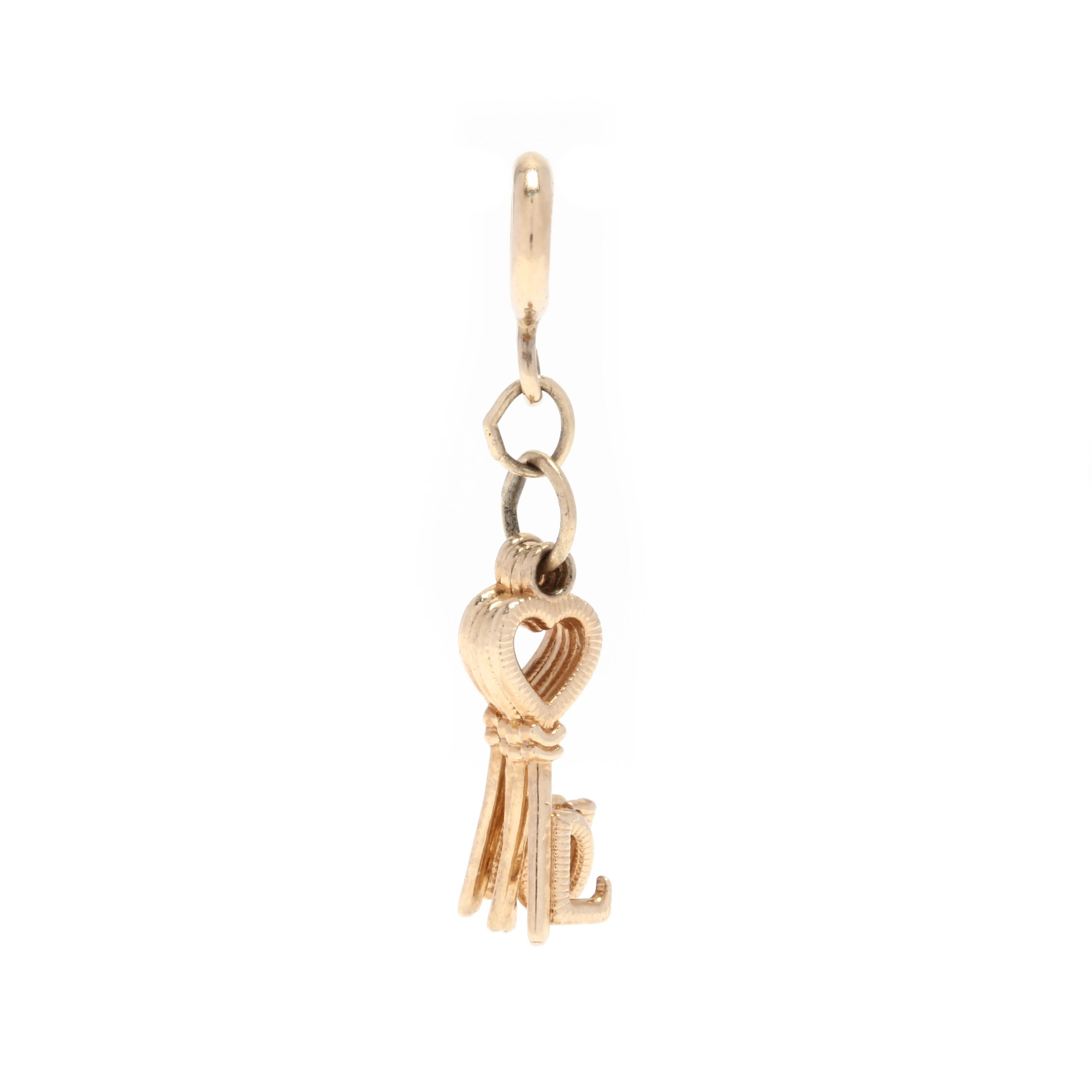 14 Karat Yellow Gold 'LOVE' Keys Charm / Pendant In Good Condition In McLeansville, NC