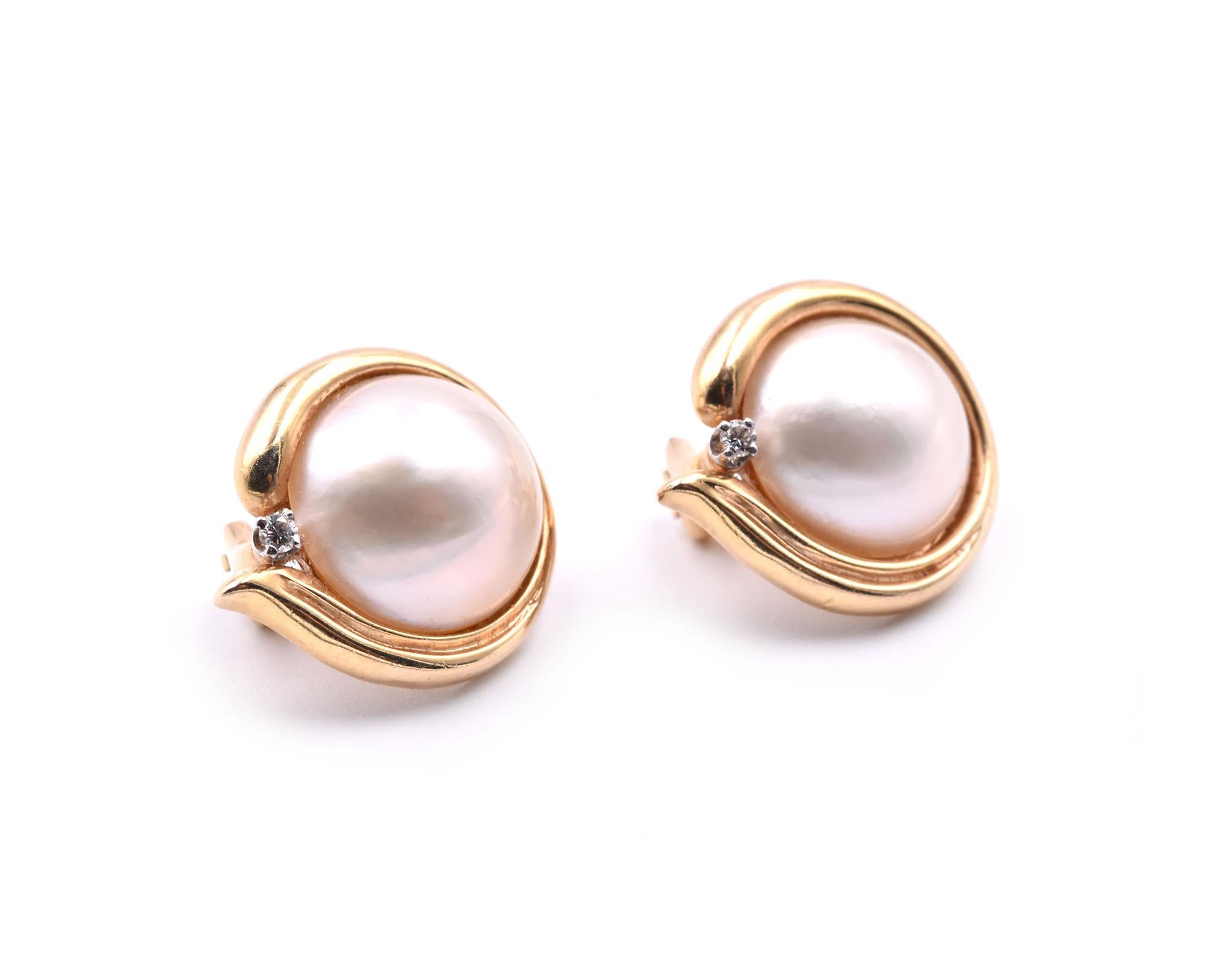 Designer: custom design
Material: 14k yellow gold
Pearls: 2 Mabe pearls approximately 12.5mm
Diamonds: 2 round brilliant cut= .03cttw
Fastenings: clip-on backs
Weight: 8.30 grams
