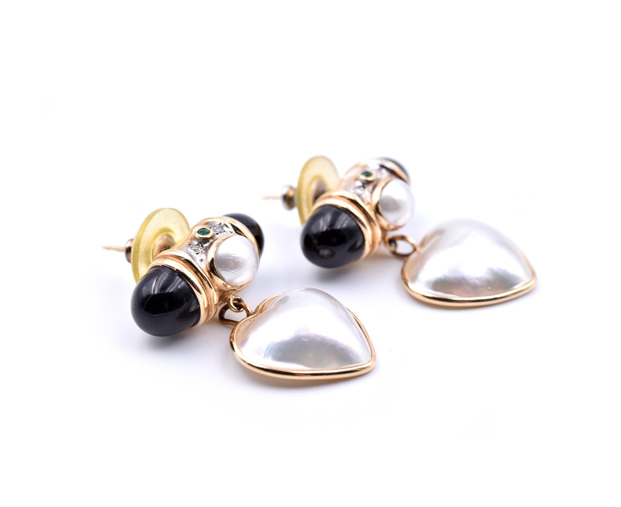 Designer: custom design
Material: 14k yellow gold
Pearls: heart shaped mabe pearls = 15.80mm x 17.05mm
Fastening: post with friction back
Dimensions: Earrings measure approximately 31mm x 23.15mm
Weight: 11.60 grams
