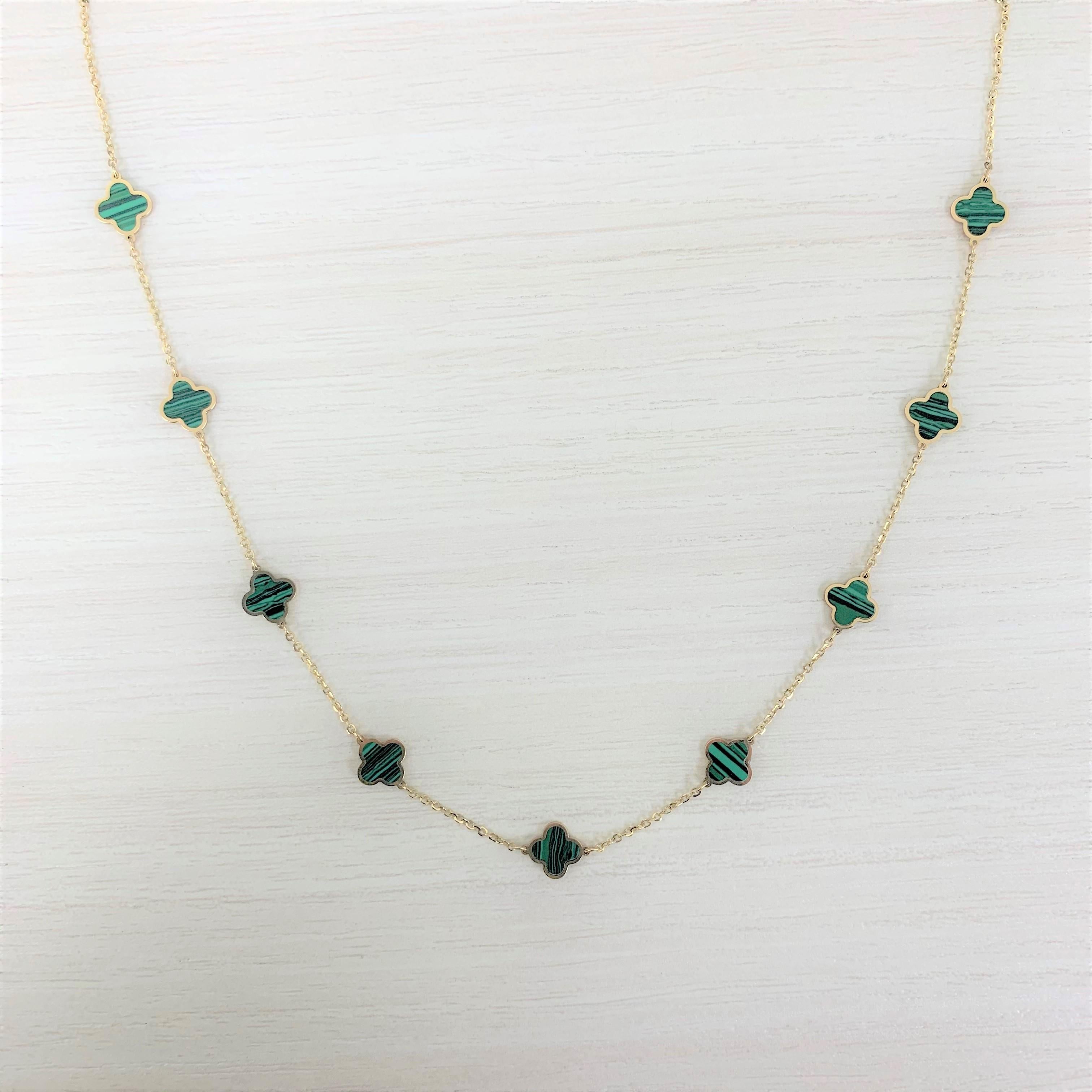 Quality Gemstone Clover Necklace: Focused on design and detail, this beautiful colored gemstone necklace features a station design and is crafted of 14k yellow gold. Necklace measurement is 18