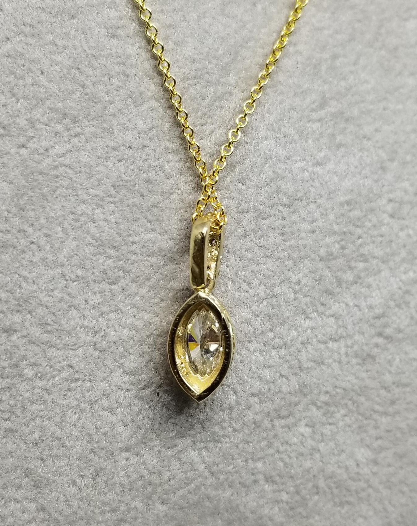 Marquise Cut 14 Karat Yellow Gold Marquise and Diamond Halo Pendant Total Weight .55pts For Sale