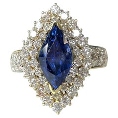 Bague en or jaune 14 carats avec saphir bleu taille marquise et diamants