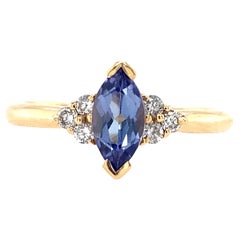 Bague en or jaune 14 carats avec tanzanite taille marquise et diamants