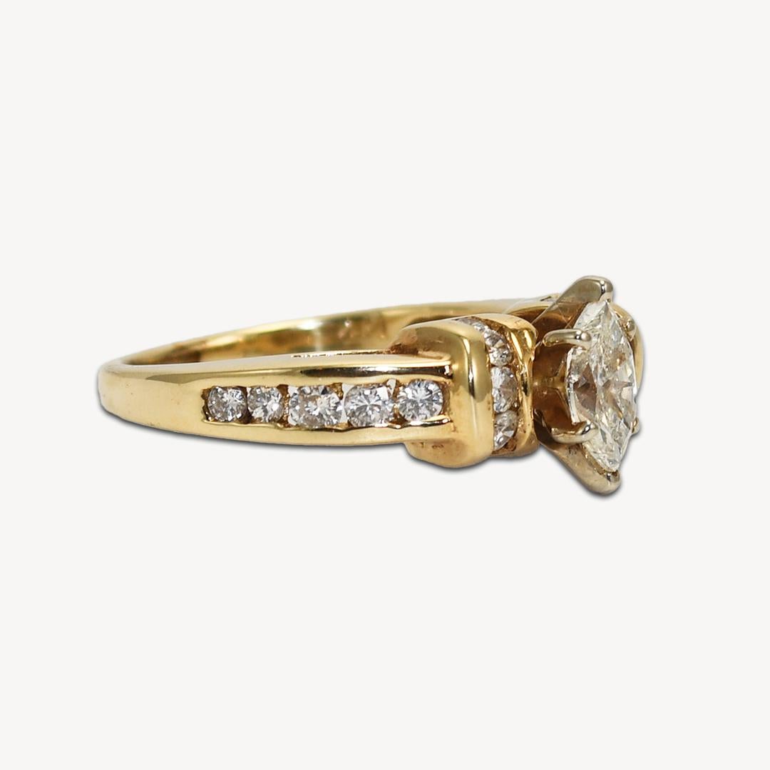14k yellow gold ring with diamonds.
Marked 14k and weighs 4.4 grams.
The center diamond is a marquise shape, .65 carats, i color, si1 clarity, very good proportions.
The side diamonds are round brilliant cuts, .33 carats total weight, g to h color,