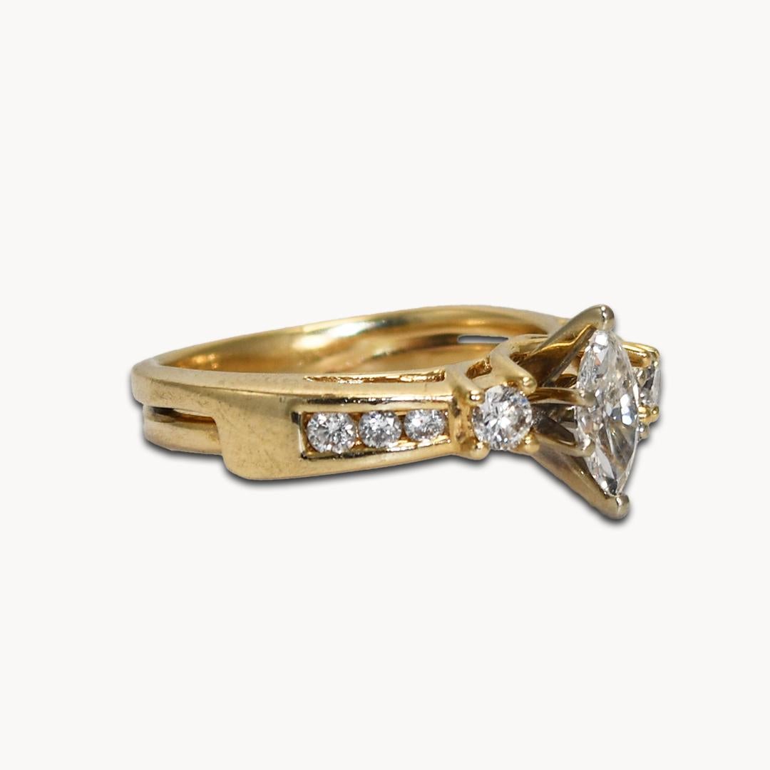 Marquise diamond ring in 14k yellow gold.
The center diamond is a marquise shape, .33 carats, h to i color, vs2 clarity, excellent cut.
On the sides are round brilliant cut diamonds, .20 total carats, h color, si clarity.
Tests 14k and weighs 3.7