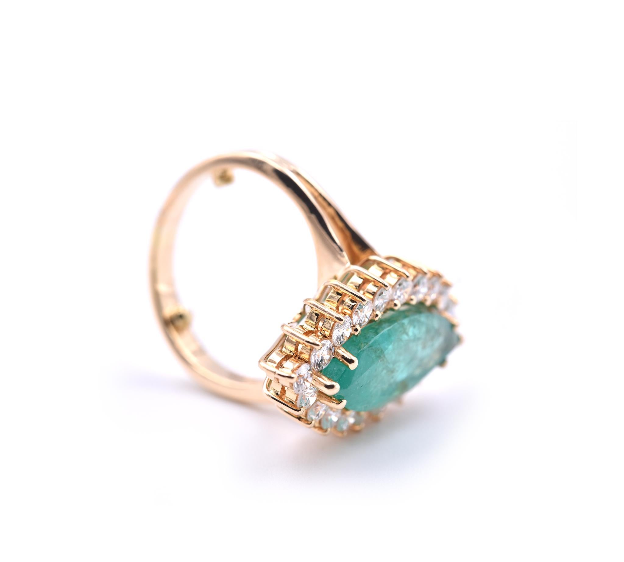 Designer: custom design
Material: 14k yellow gold 
Emerald: 1 marquise cut = 3.00ct
Diamonds: 20 round brilliant cuts = 1.00cttw
Color: G-H
Clarity: SI1
Ring Size: (please allow two additional shipping days for sizing requests)
Dimensions: ring top