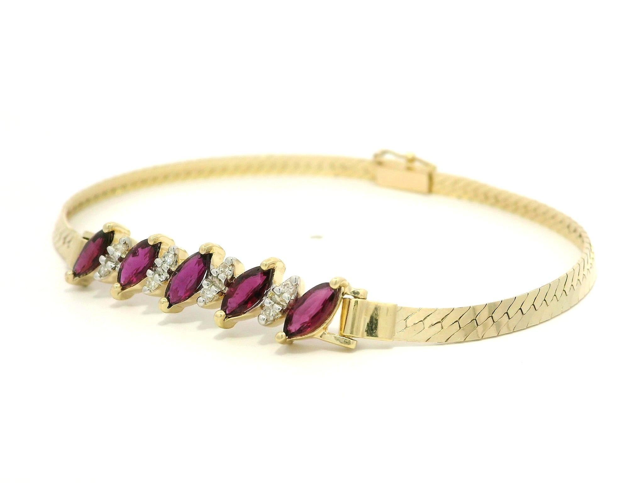 --Stone(s):--
(5) Natural Genuine Rubies - Marquise Cut - Prong Set - Rich Burgundy Color - 5.5 x 2.8mm (approx.) - 1.10ctw (approx.) 
(5) Natural Genuine Diamonds - Round Brilliant Cut - Pave Set - Nice Brilliant White Color - 0.08ctw (approx.)