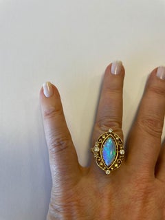 14 Karat Yellow Gold Marquise Shape Opal and Diamond Ring Vintage Design