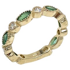 14K Yellow Gold Marquise Shaped Emerald and Diamond Eternity Ring