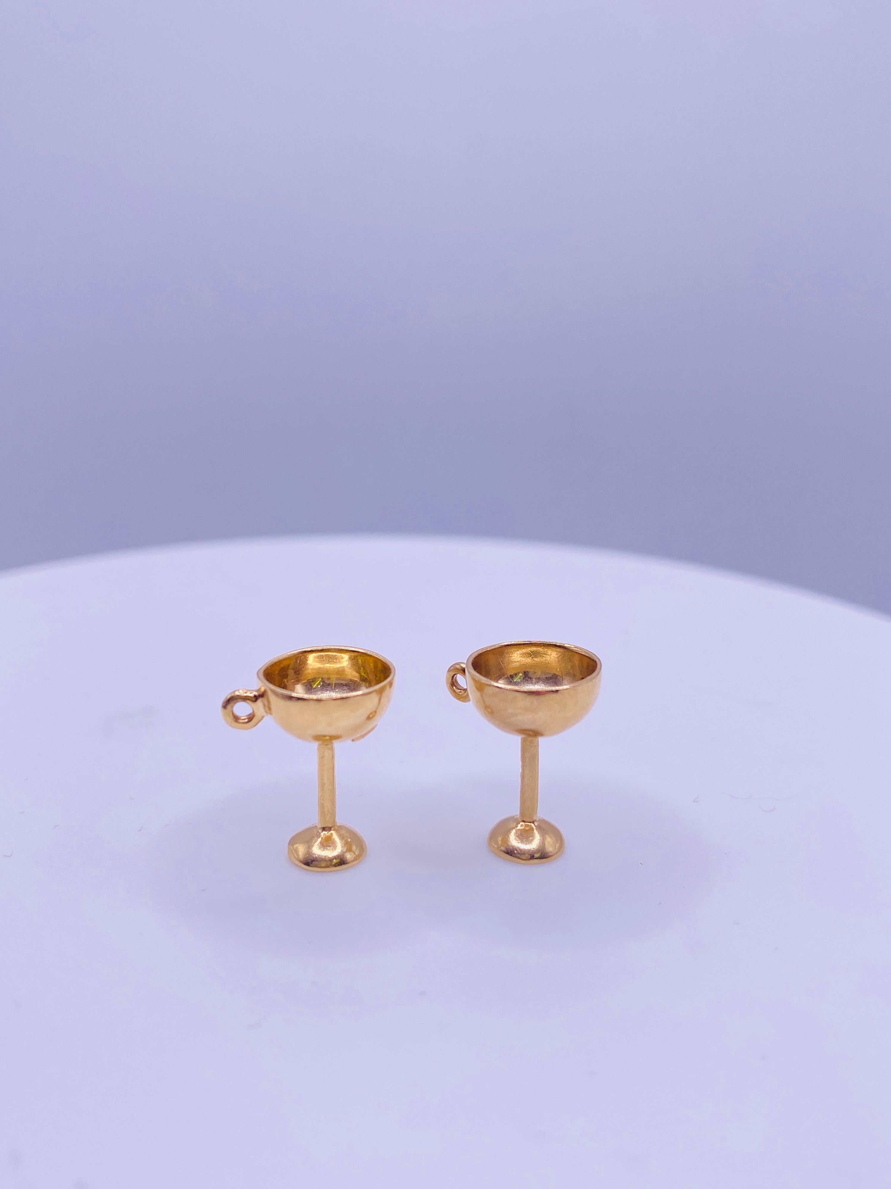 14K yellow gold martini glass charms, one with green enamel olive