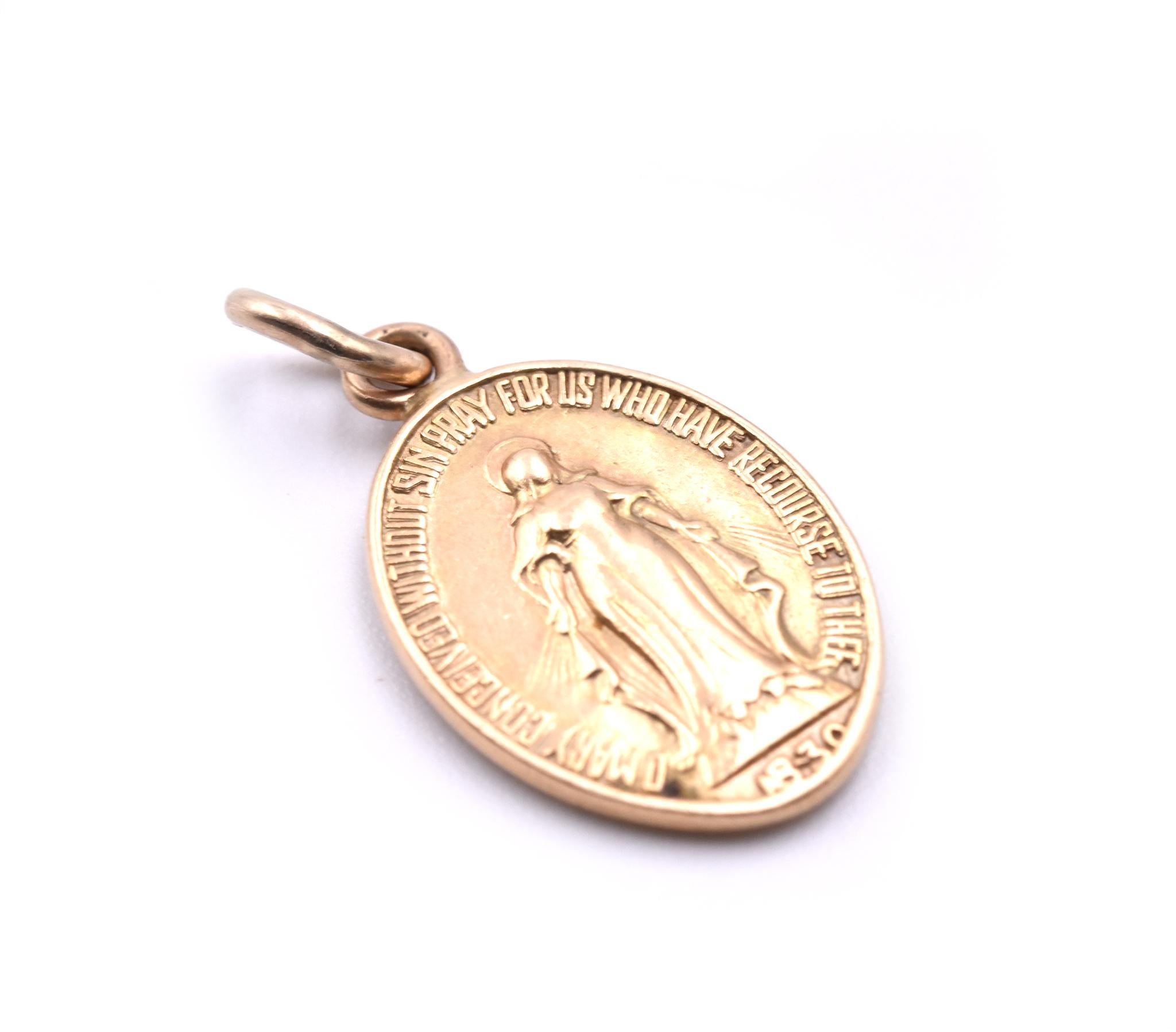 Designer: custom design
Material: 14k yellow gold 
Dimensions: pendant is 11.88mm by 22mm including vail
Weight:  2.41 grams
