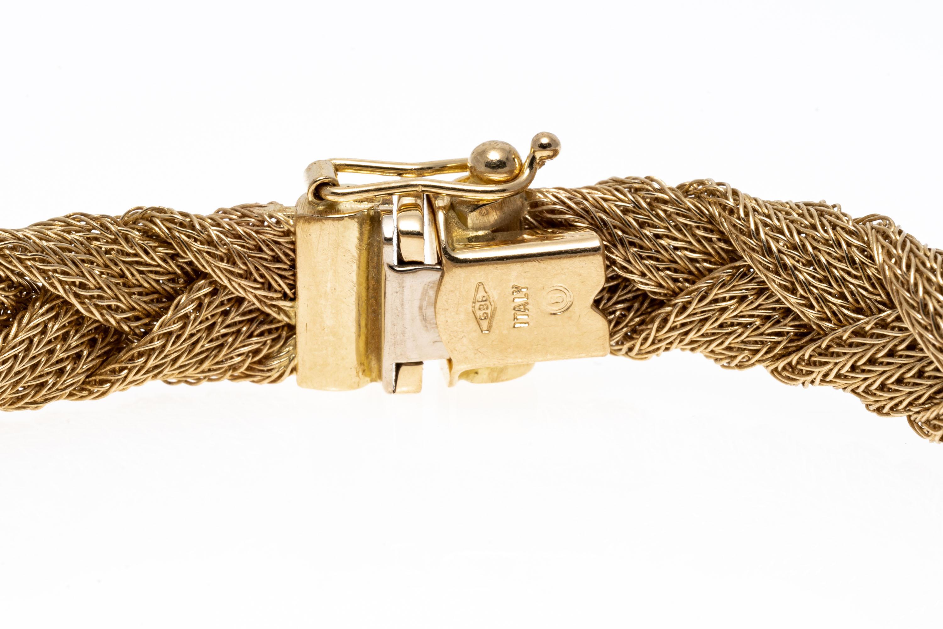 14k Yellow Gold Matte Finished Braided Woven Bracelet.
This classic bracelet is a matte finished, braided weave, set with a hidden box style clasp and a figure eight safety clasp.
Marks: 585
Dimensions: 7 1/2