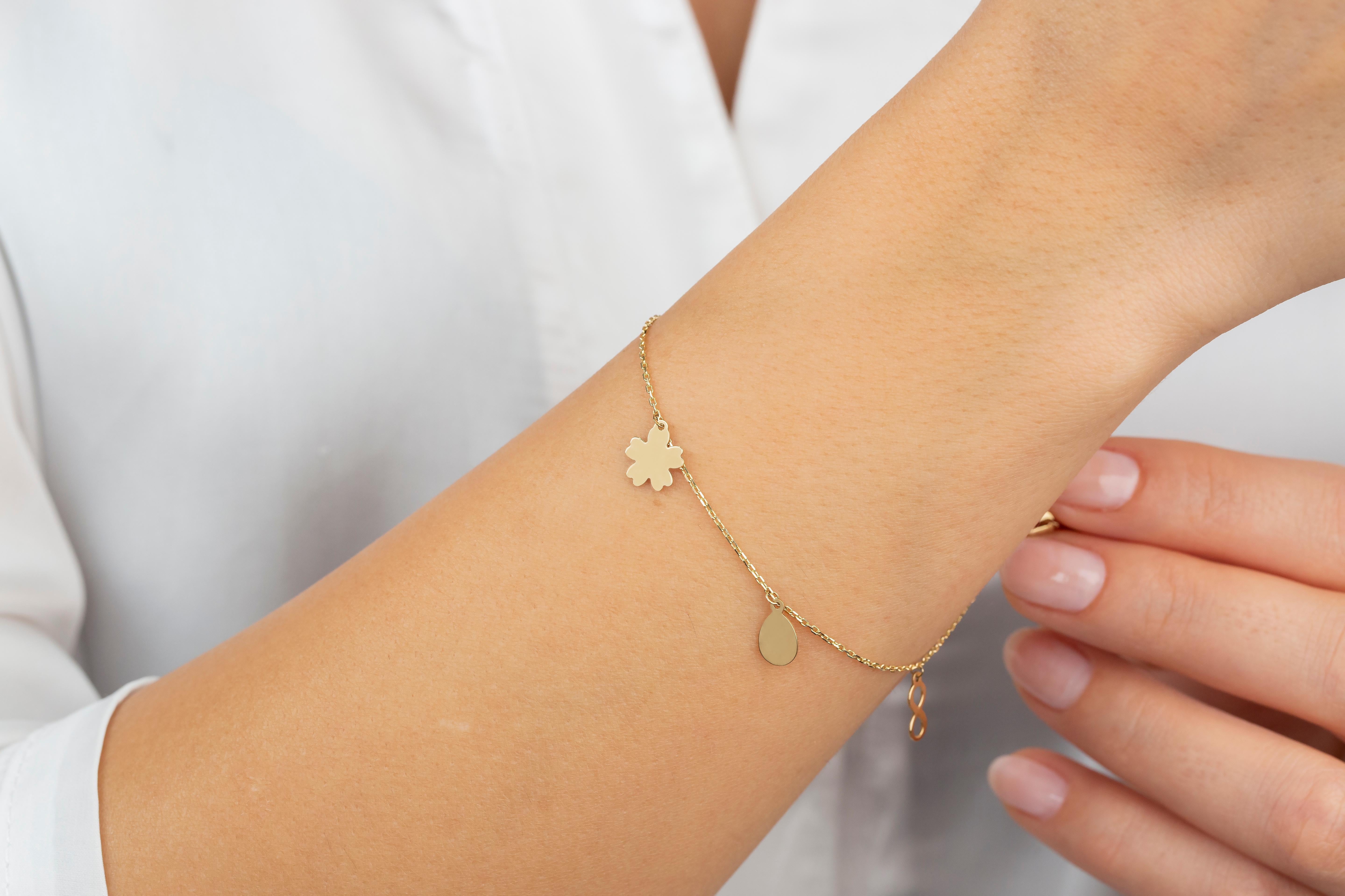 14K Yellow Gold Meaningful Charms Dainty Bracelet
Made of 14 ct. solid gold.
With hallmark.

Total Weight: 1,7 gr.
Size: 21.5 cm

This piece was made with quality materials and excellent handwork. I guarantee the quality assurance of my handwork and