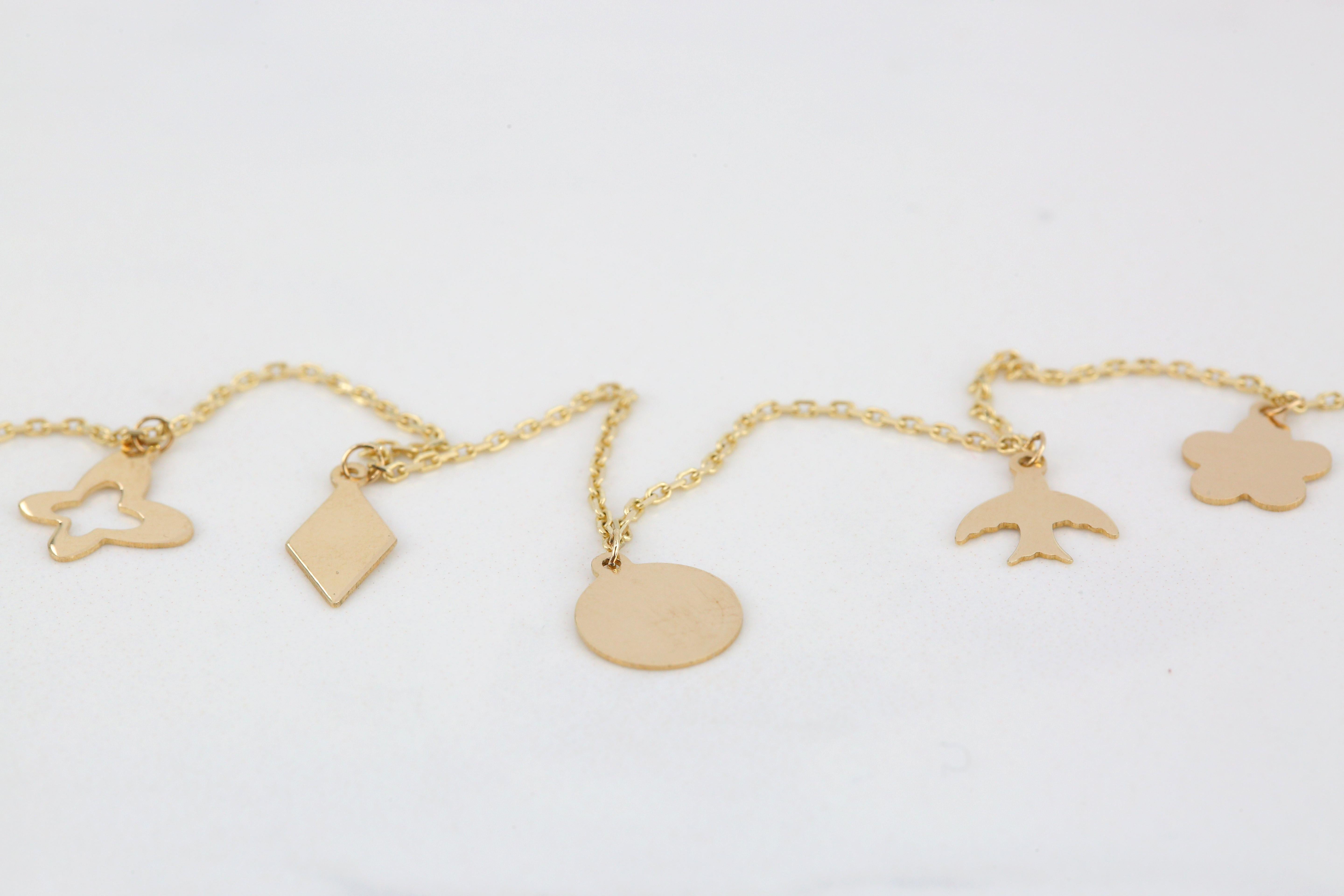 Contemporary 14K Yellow Gold Meaningful Charms Dainty Bracelet For Sale