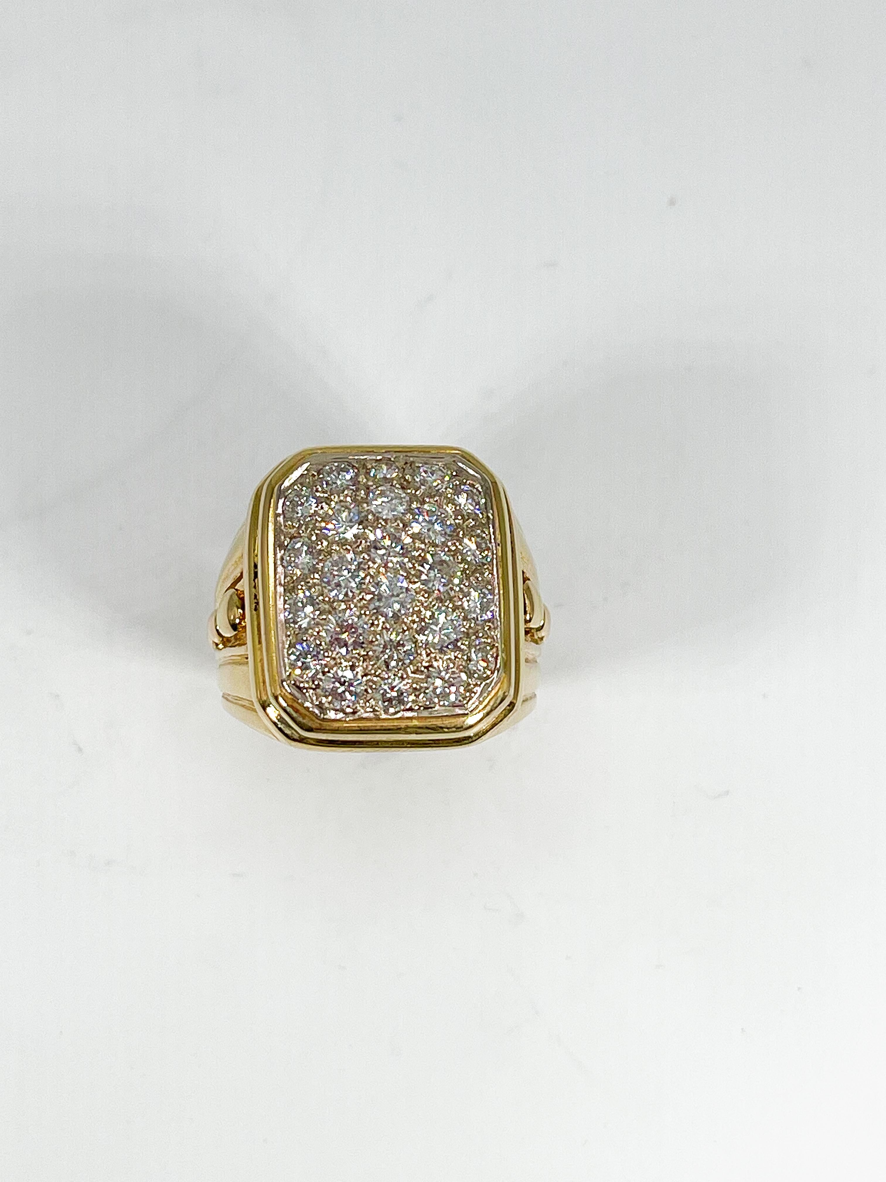 14k yellow gold mens 1 CTW diamond fashion ring. This mens ring has 24 diamonds on the face and detailing along the side of the ring. Measures a size 7 1/4 and has a weight of 17.09 grams