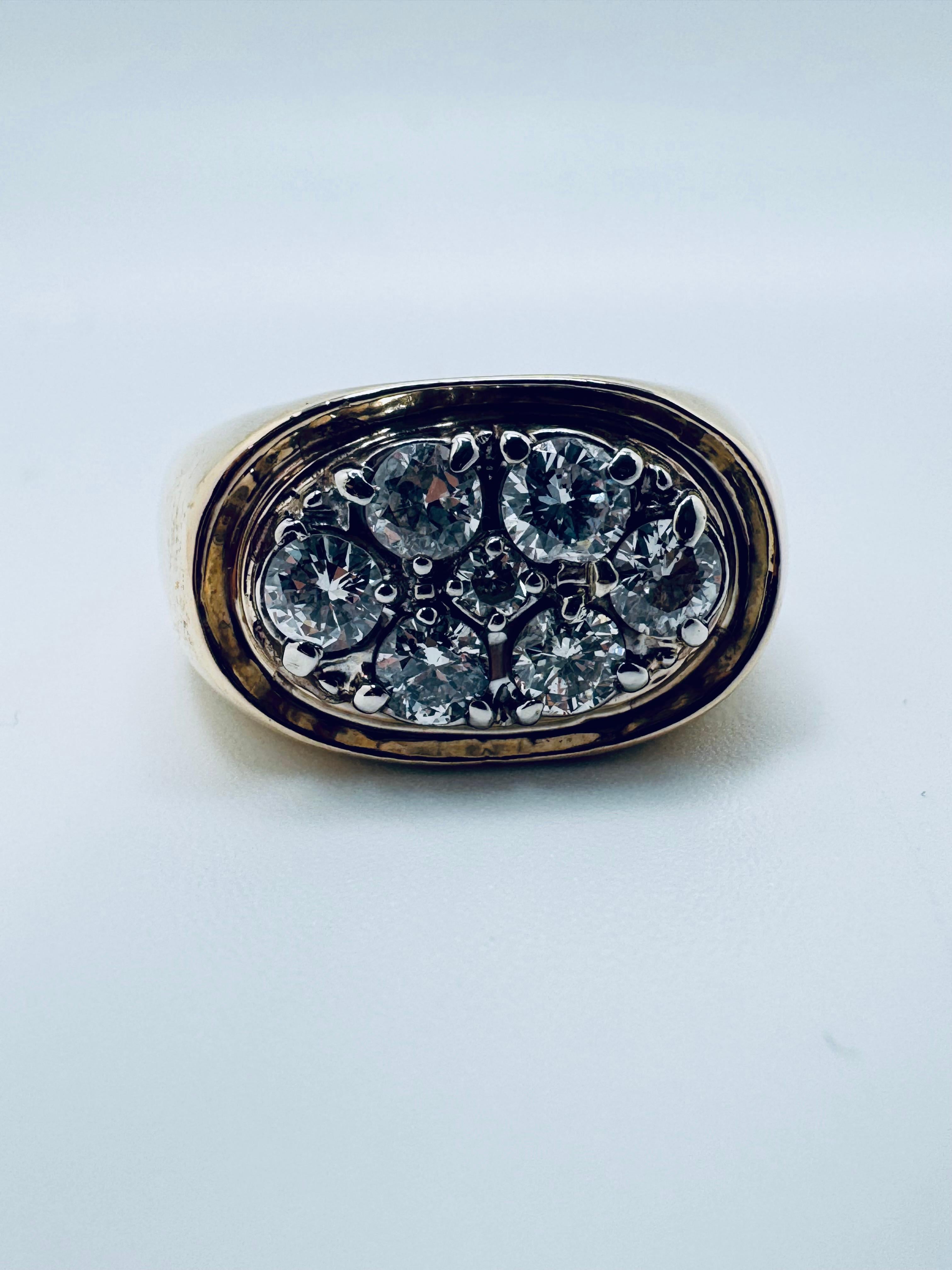 This Men’s Diamond Cluster Gold Signet Ring is a bold and distinguished piece crafted entirely from 14K yellow gold. Weighing a substantial 14.77 grams, it offers a solid, confident feel that reflects its strong design and enduring craftsmanship.