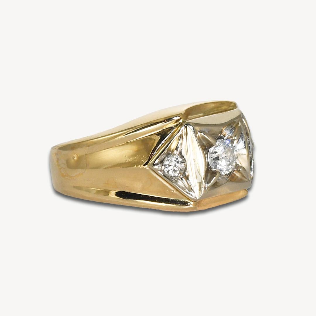 Men's diamond ring in 14k yellow gold. 
Tests 14k and weighs 11.8 grams. 
The center diamond is a round brilliant cut, .30 carats, H-I color, i1 clarity, excellent cut.
The two round brilliant side diamonds weigh .15 total carats. 
The top of the